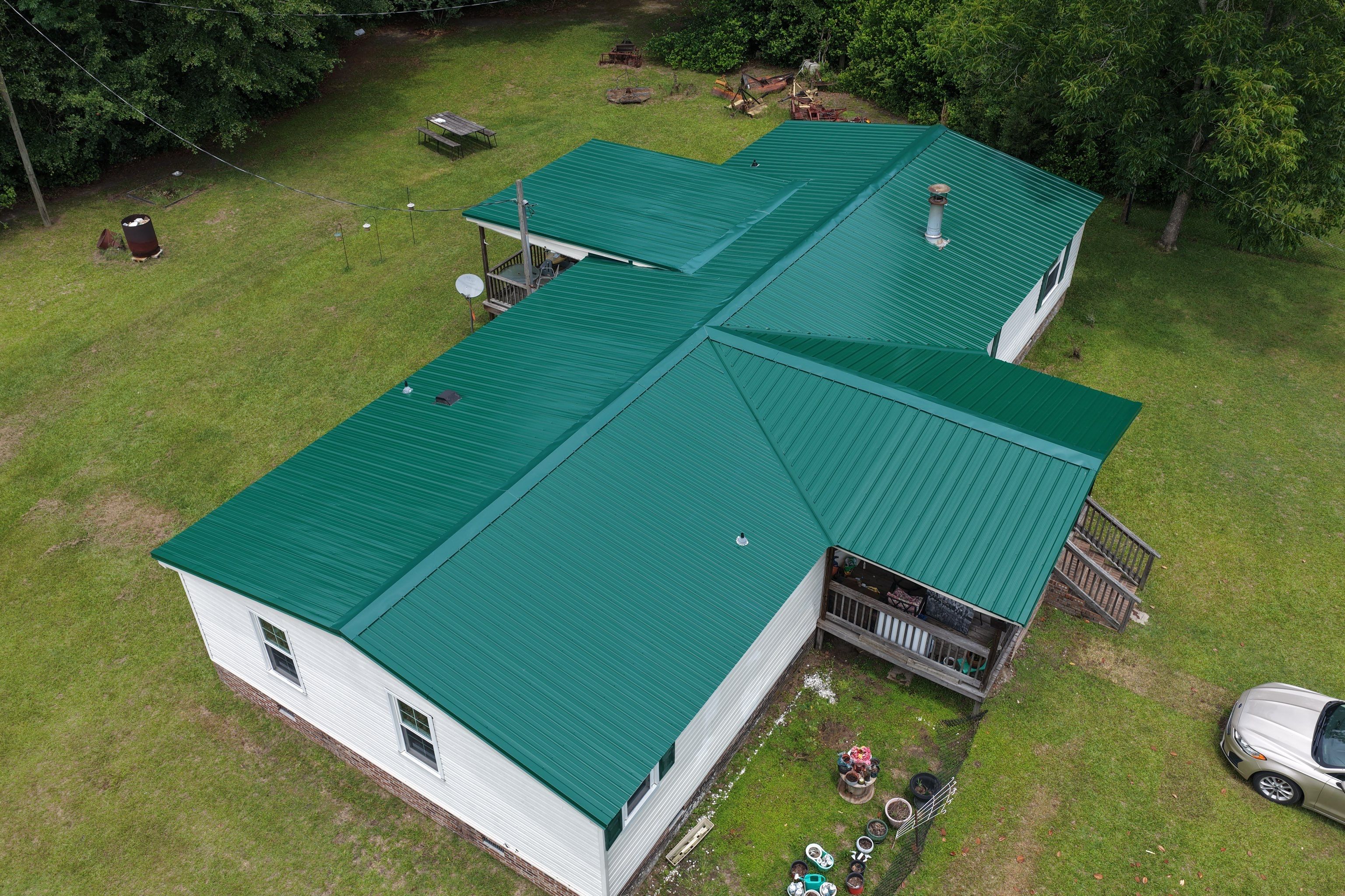 Standing Seam Green Metal Roof Installation in Sumter by Exterior Genie, LLC