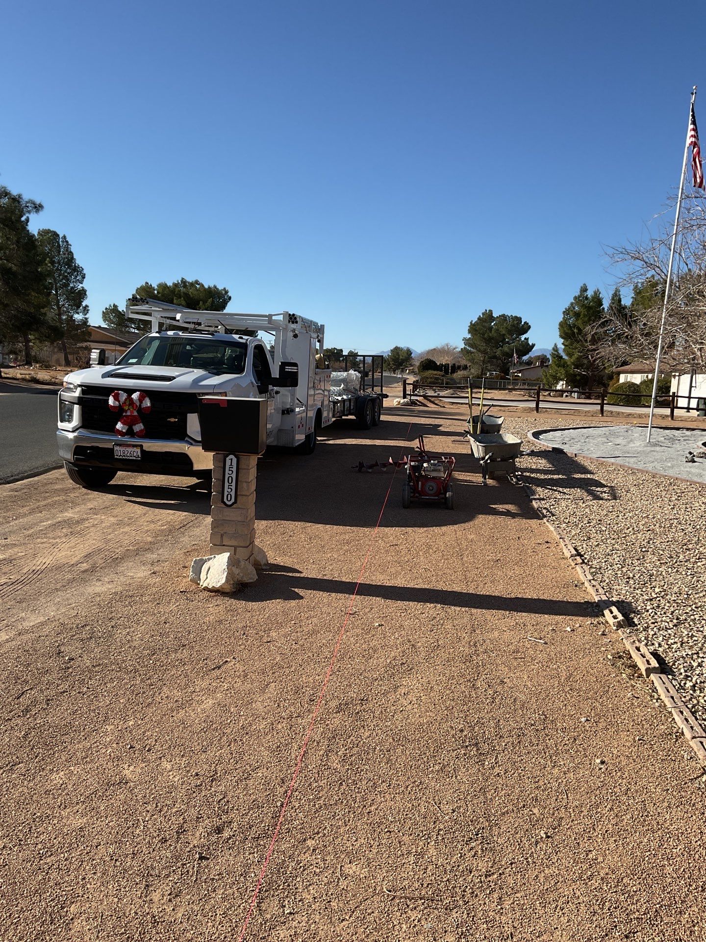 Sleek chain link fence installation with a solar motorized gate by Fence Guys Inc.