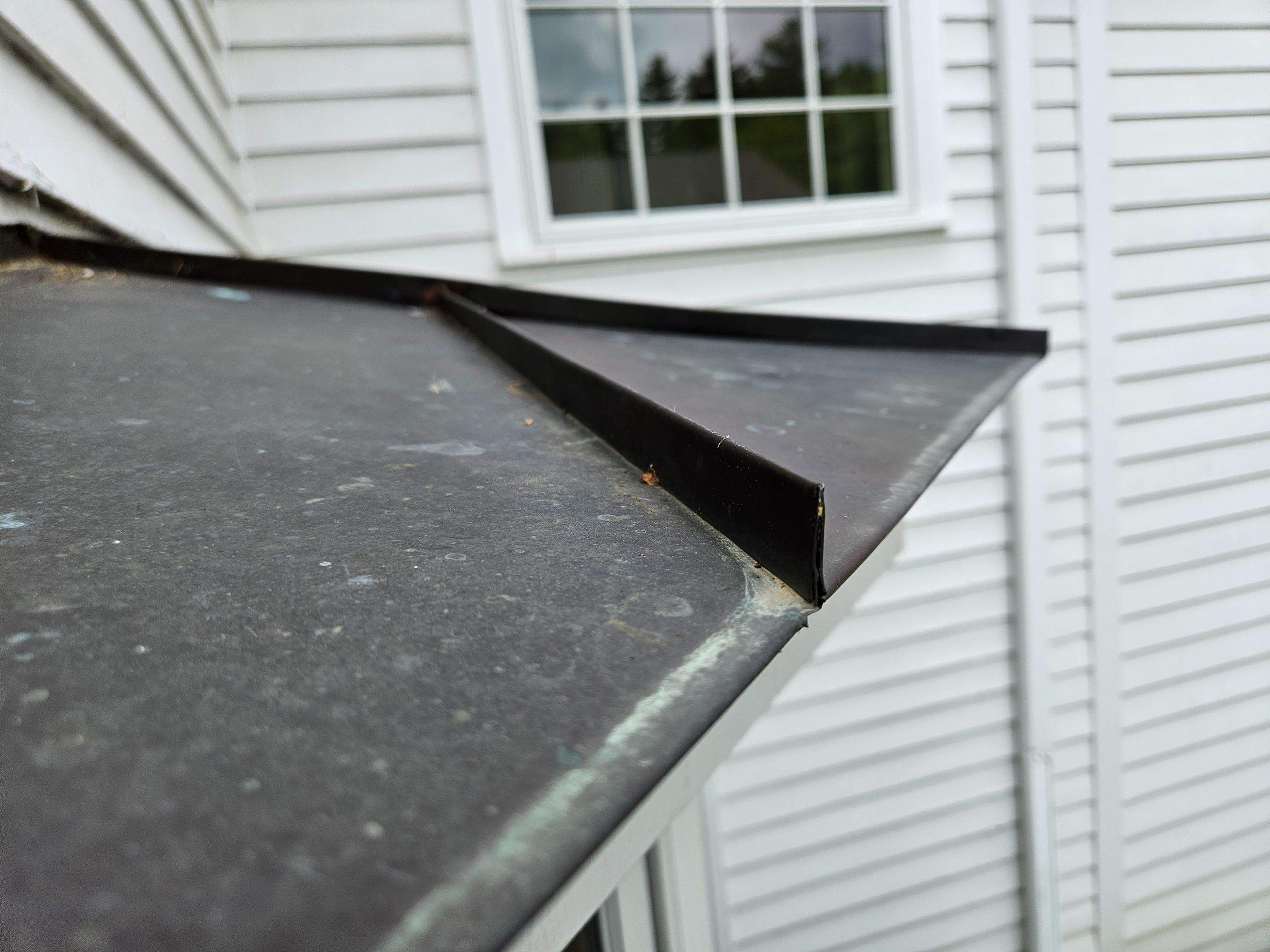 Copper Roof using Copper by Absolute Roofing and Construction