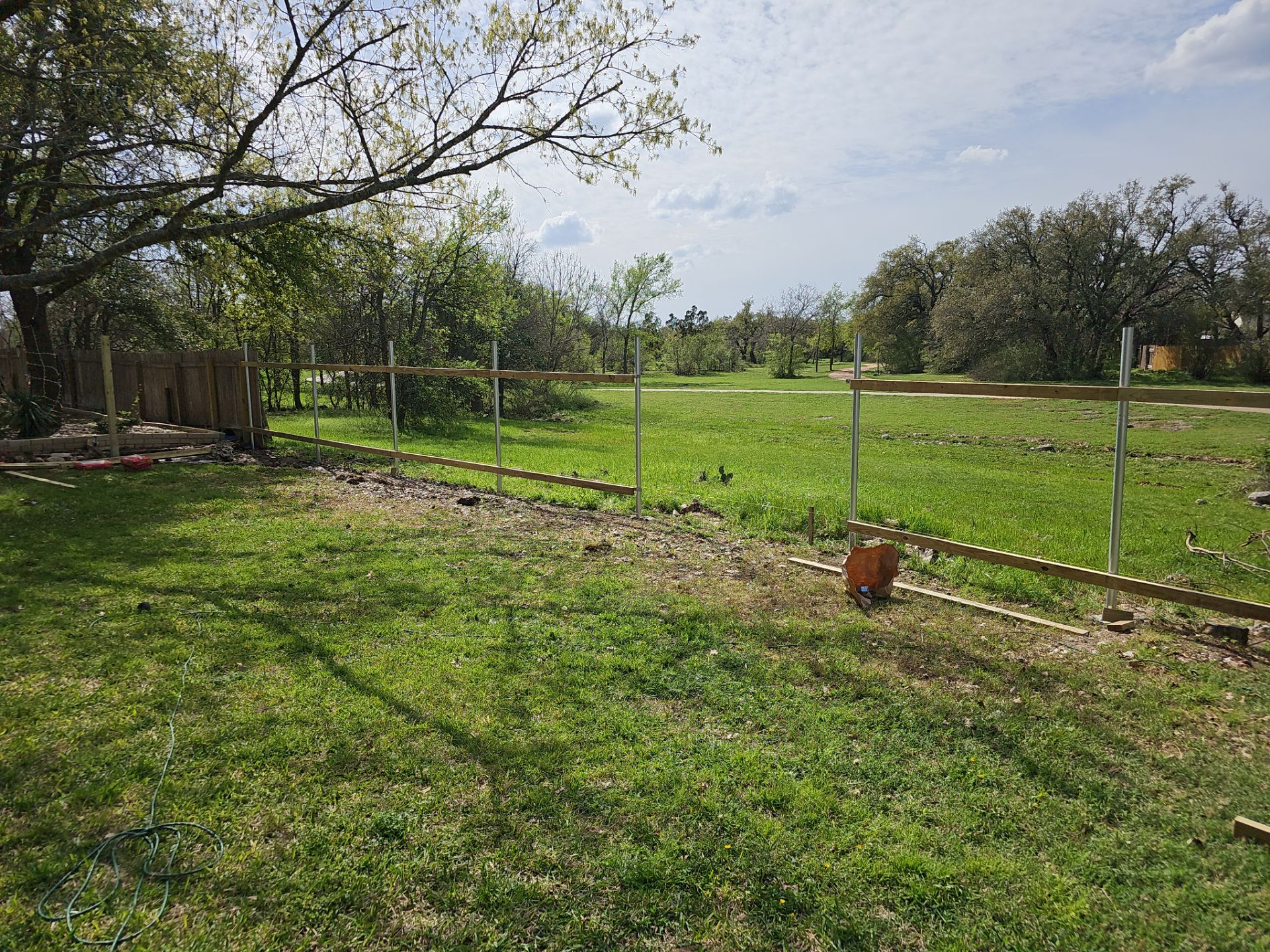 Fence Installation using Cedar Pickets by DeZign Roofing & Exteriors