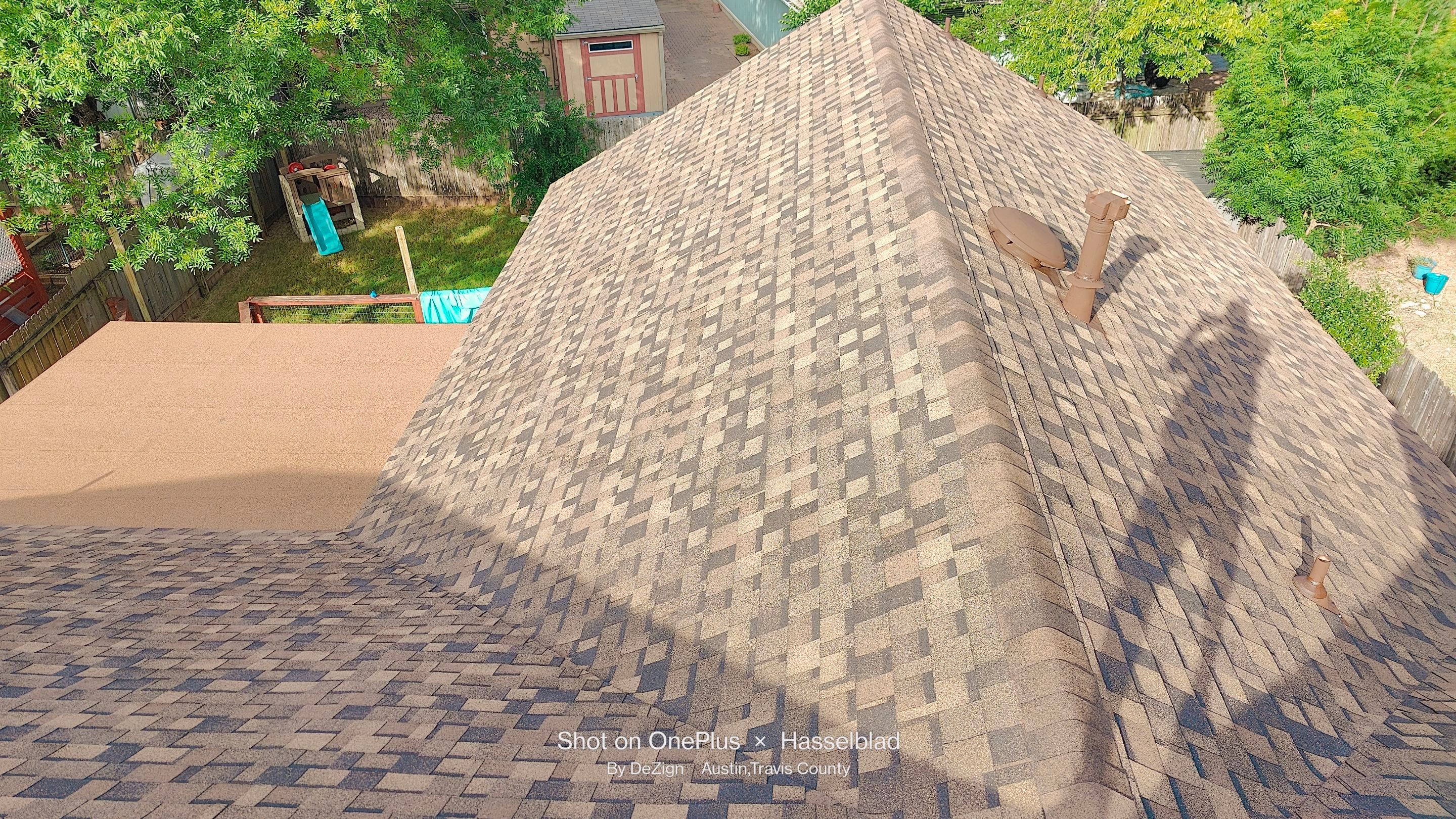 New Roof Installation Of IKO Dynasty Color Brownstone by DeZign Roofing & Exteriors