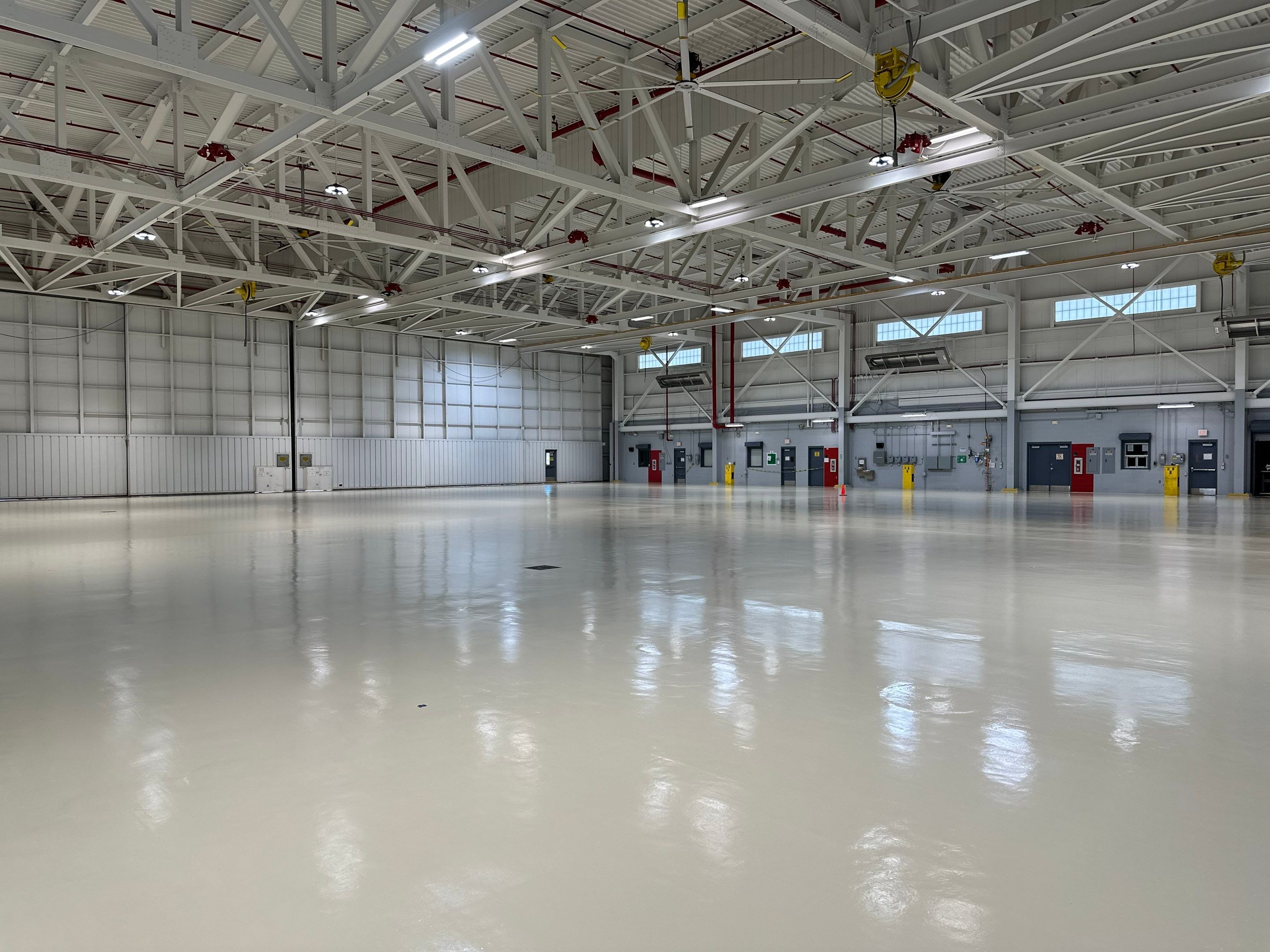 Industrial Epoxy Flooring for Army National Guard Hangar in Mobile by Cornerstone Hard Surface Restoration 