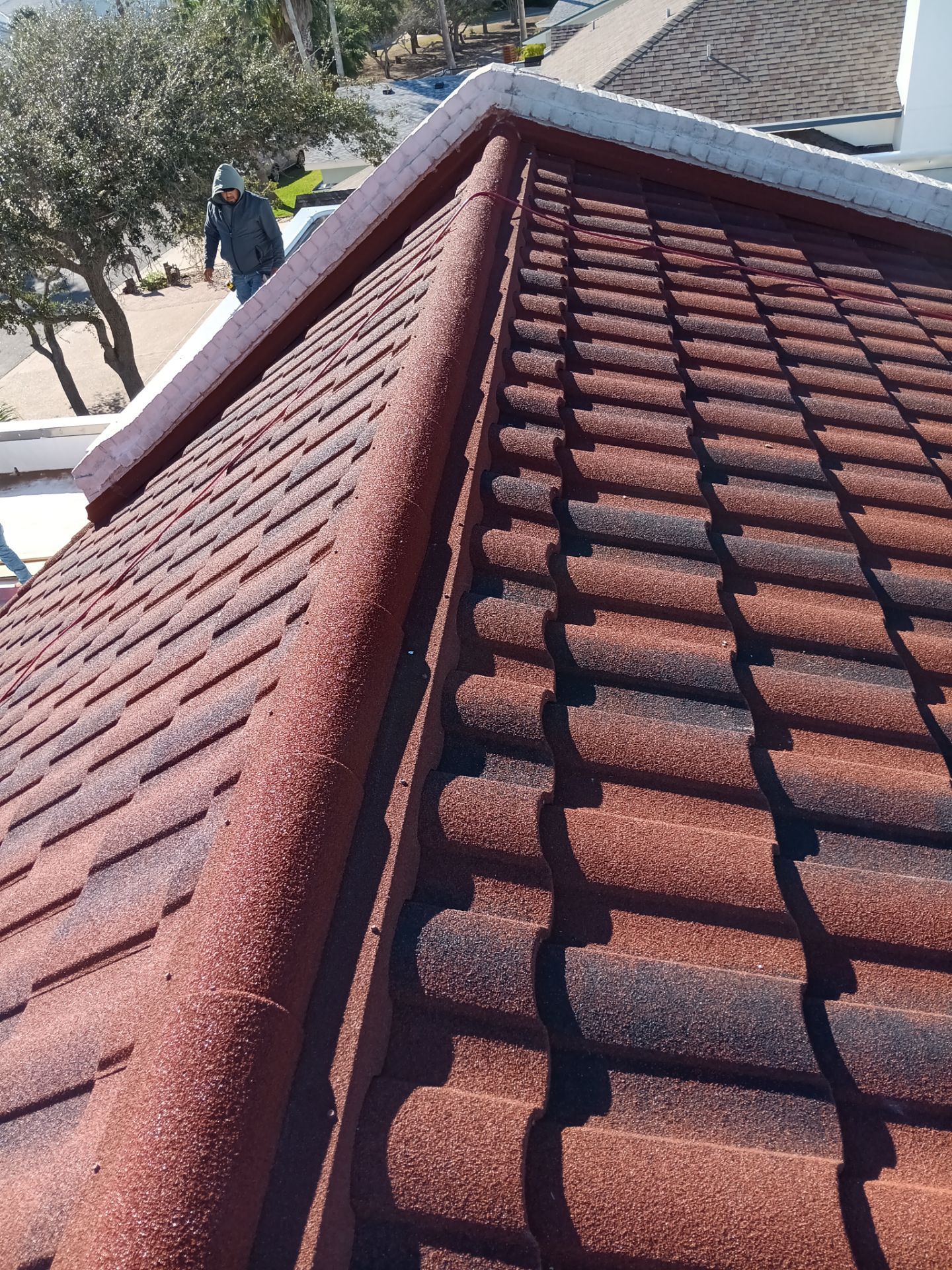 Off with the Tile and on with the TILCOR stone coated metal.  by Bayfront Roofing and Construction