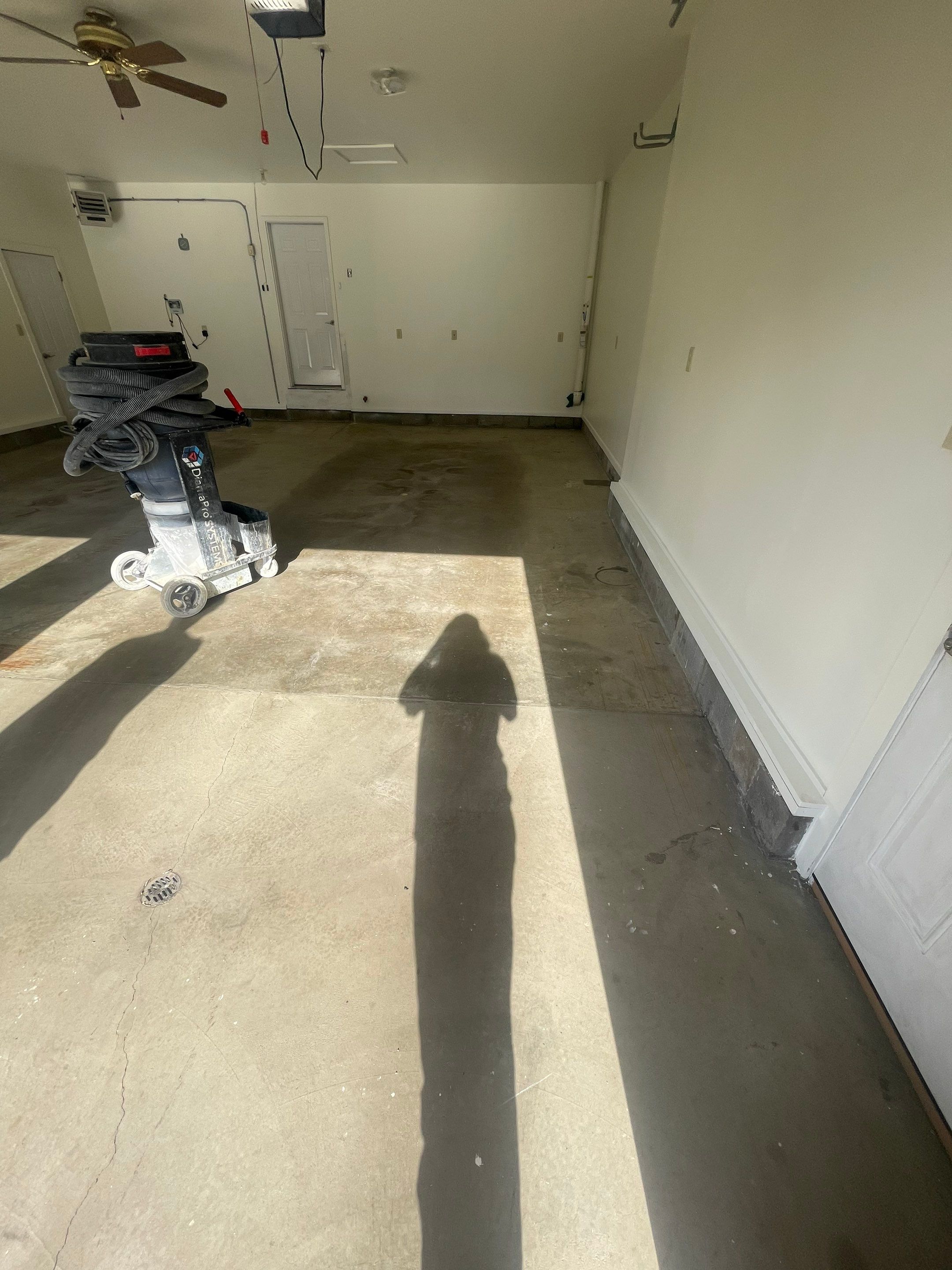 Madison Garage Concrete Coating with Feather Grey Speckle Finish by Select Painting, Coatings & Garage Cabinets
