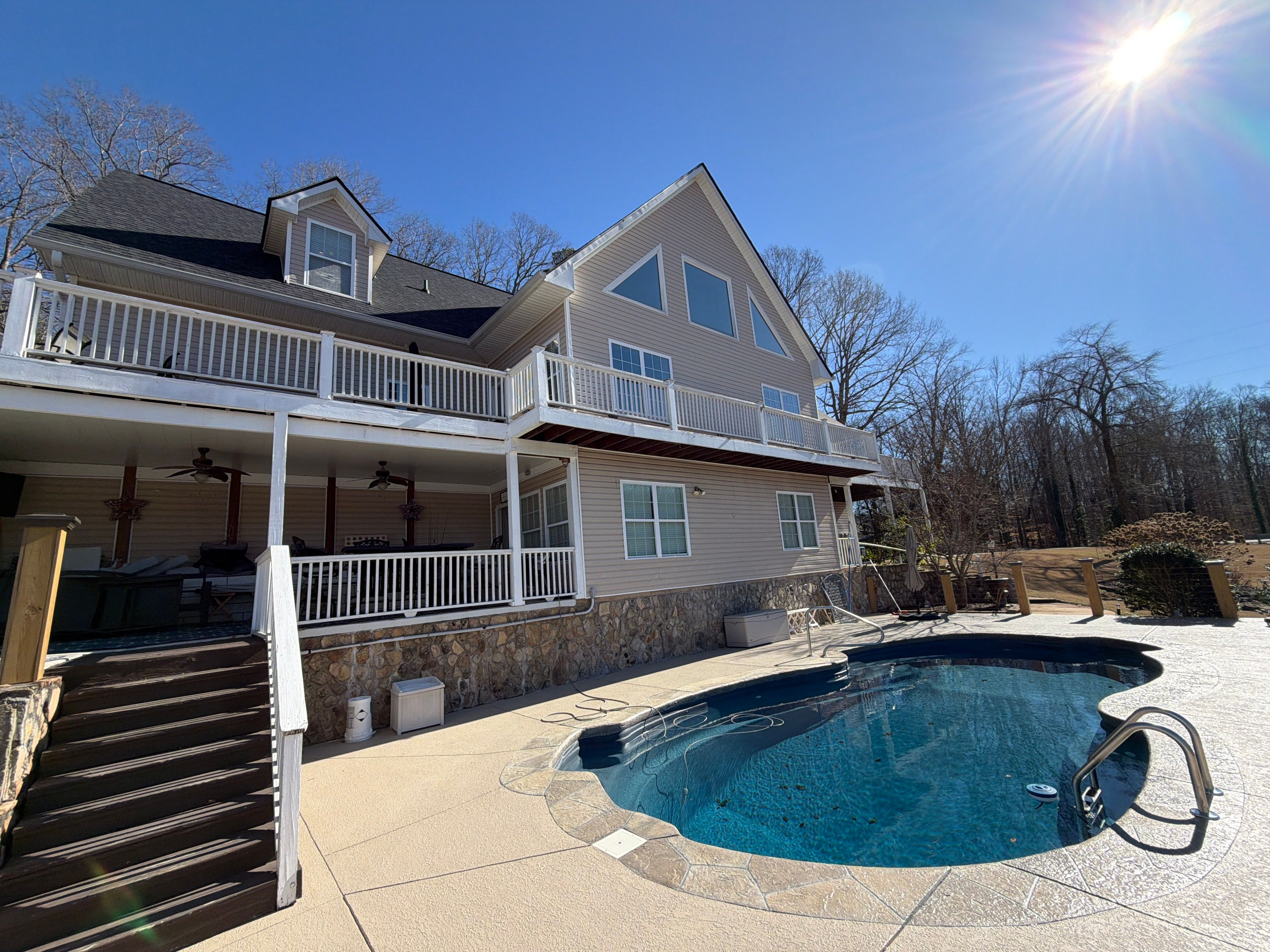 Cumming, GA Lake House Deck Resurface and Extension using Pressure Treated Pine and Skyline Cable Railing by Nelson Exteriors 