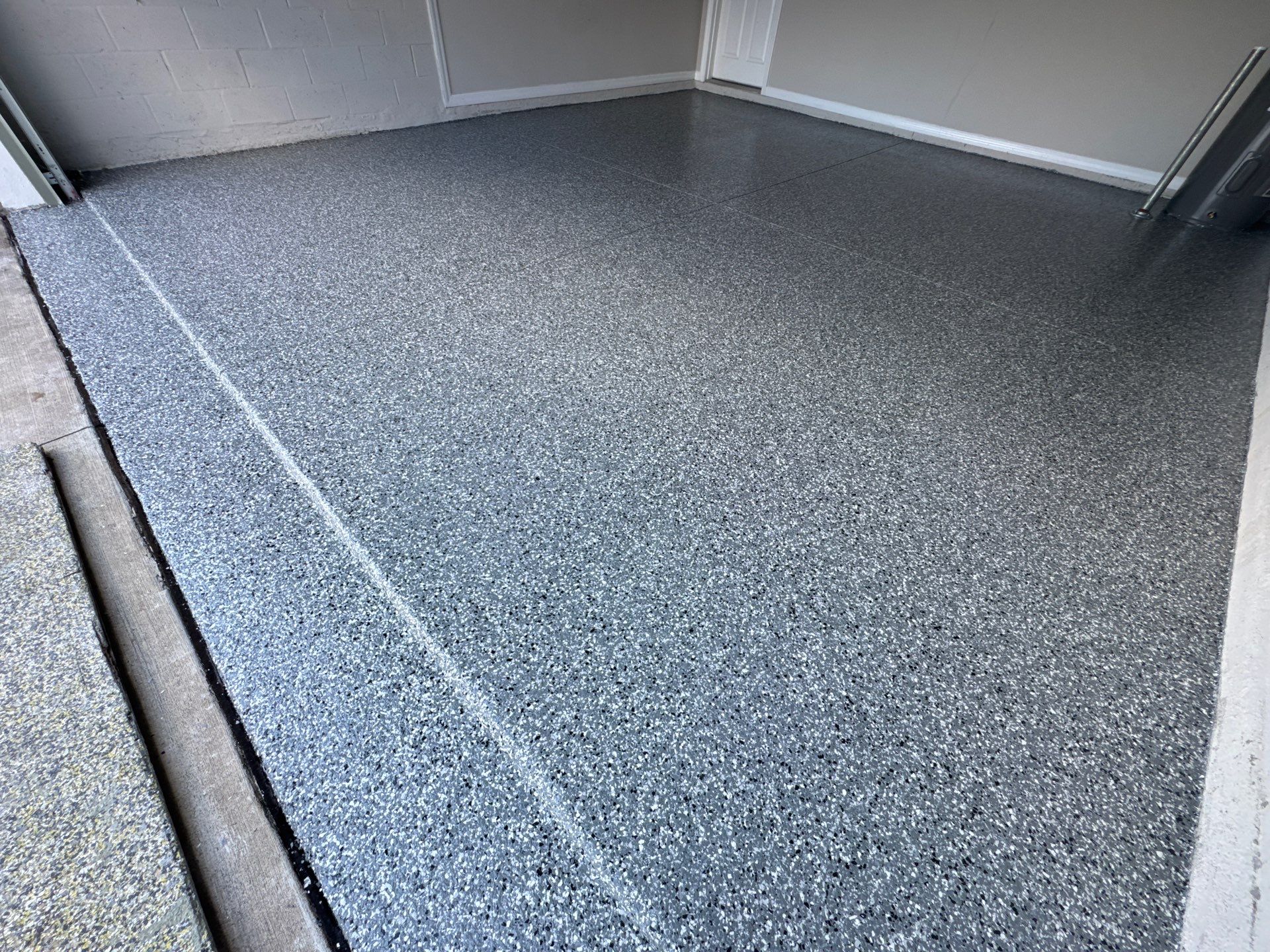 Another Wonderful Garage Transformation Using Wombat Flake by Performance Floors & Coating
