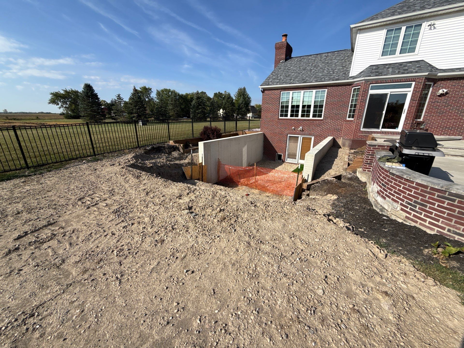 Basement Walkout Construction with Tiered Retaining Walls in Berkey by Farrell's Lawn & Garden Center LLC
