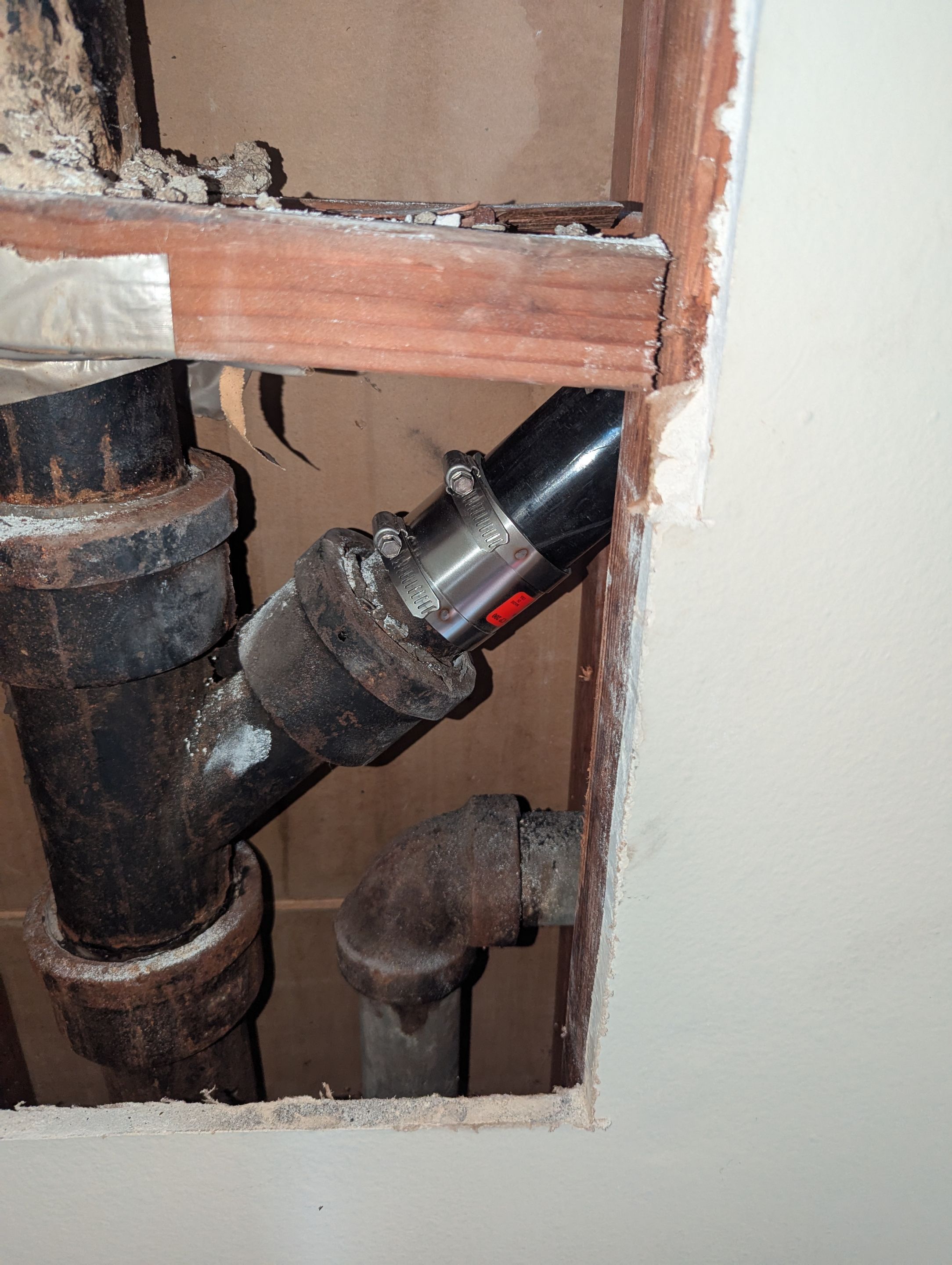 Cracked Cast Iron Line in the wall by Professional Plumbing Inc 