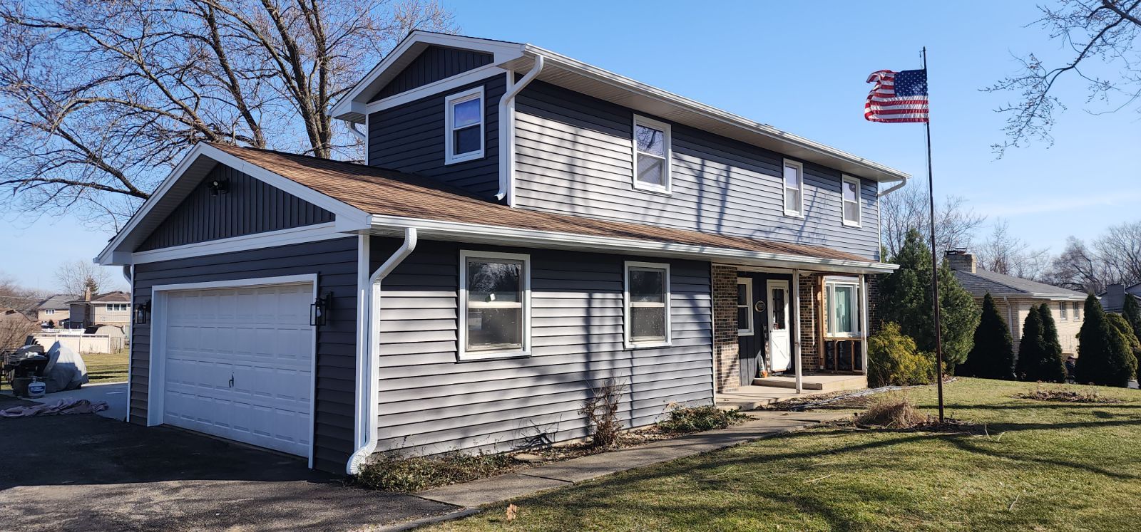 Vinyl siding replacement using CertainTeed Monogram double 5" vinyl siding  by AJ Exteriors & Roofing Inc.
