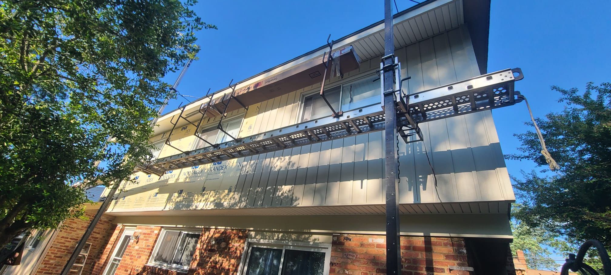 Fairfax: Residential Siding Replacement with CertainTeed 8" Board and Batten Siding in Desert Tan by RM Banning, Inc.