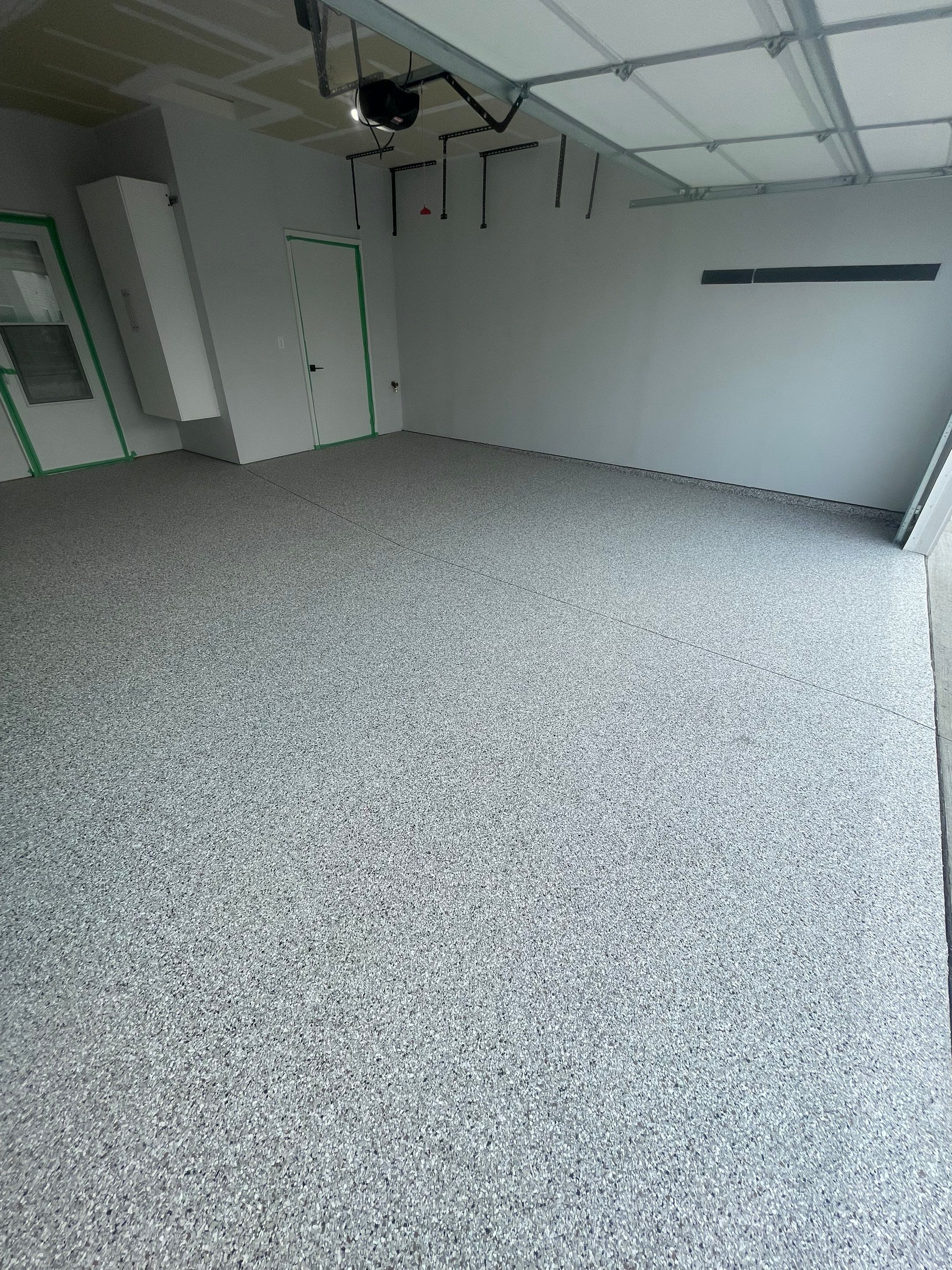 Custom Coyote Flake Garage Floor Coating in Sioux Falls by Select Painting, Coatings & Garage Cabinets