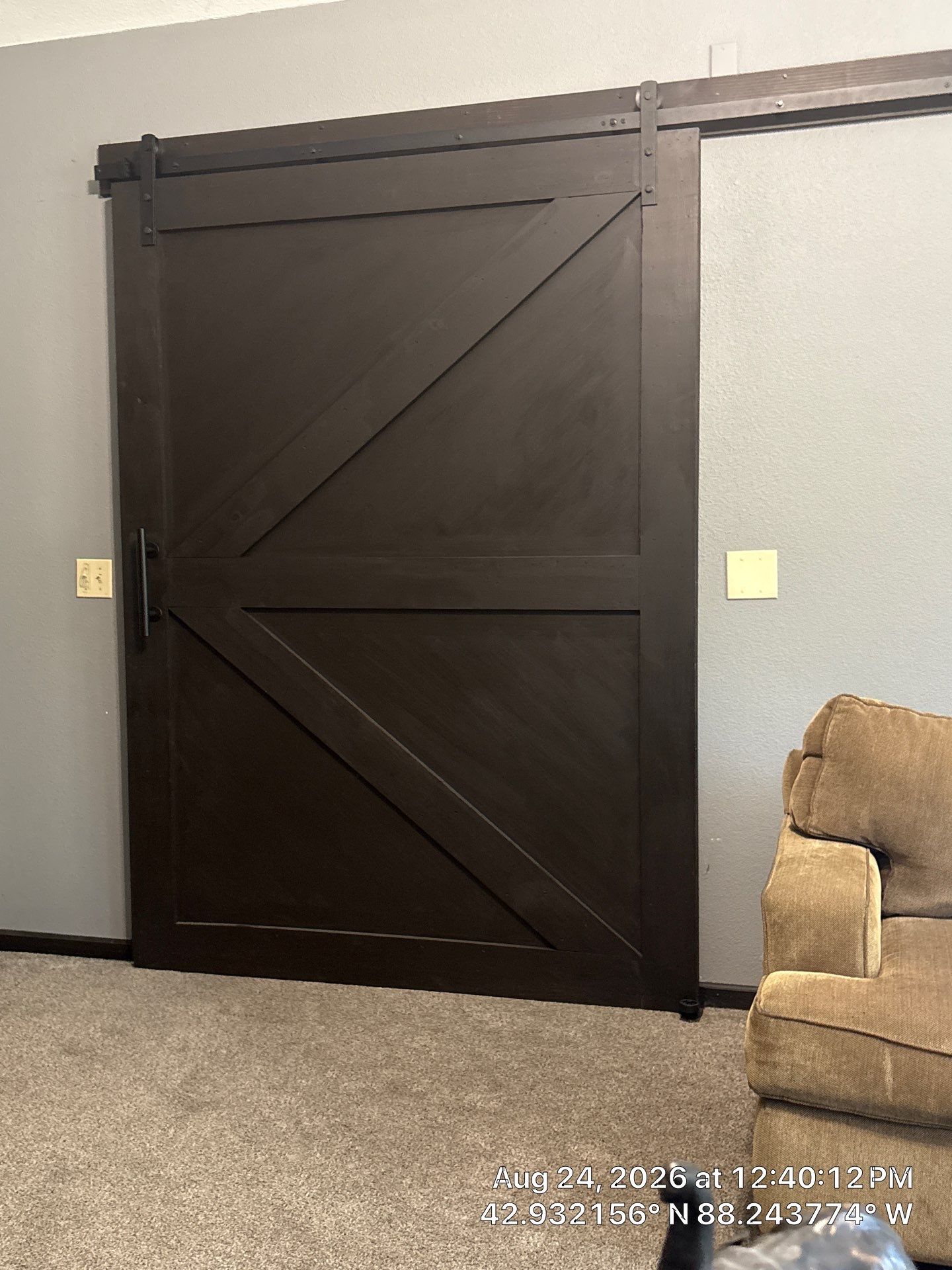 Dark Stained Sliding Barn Door Installation in Waukesha by CompanyCam Sales Demo