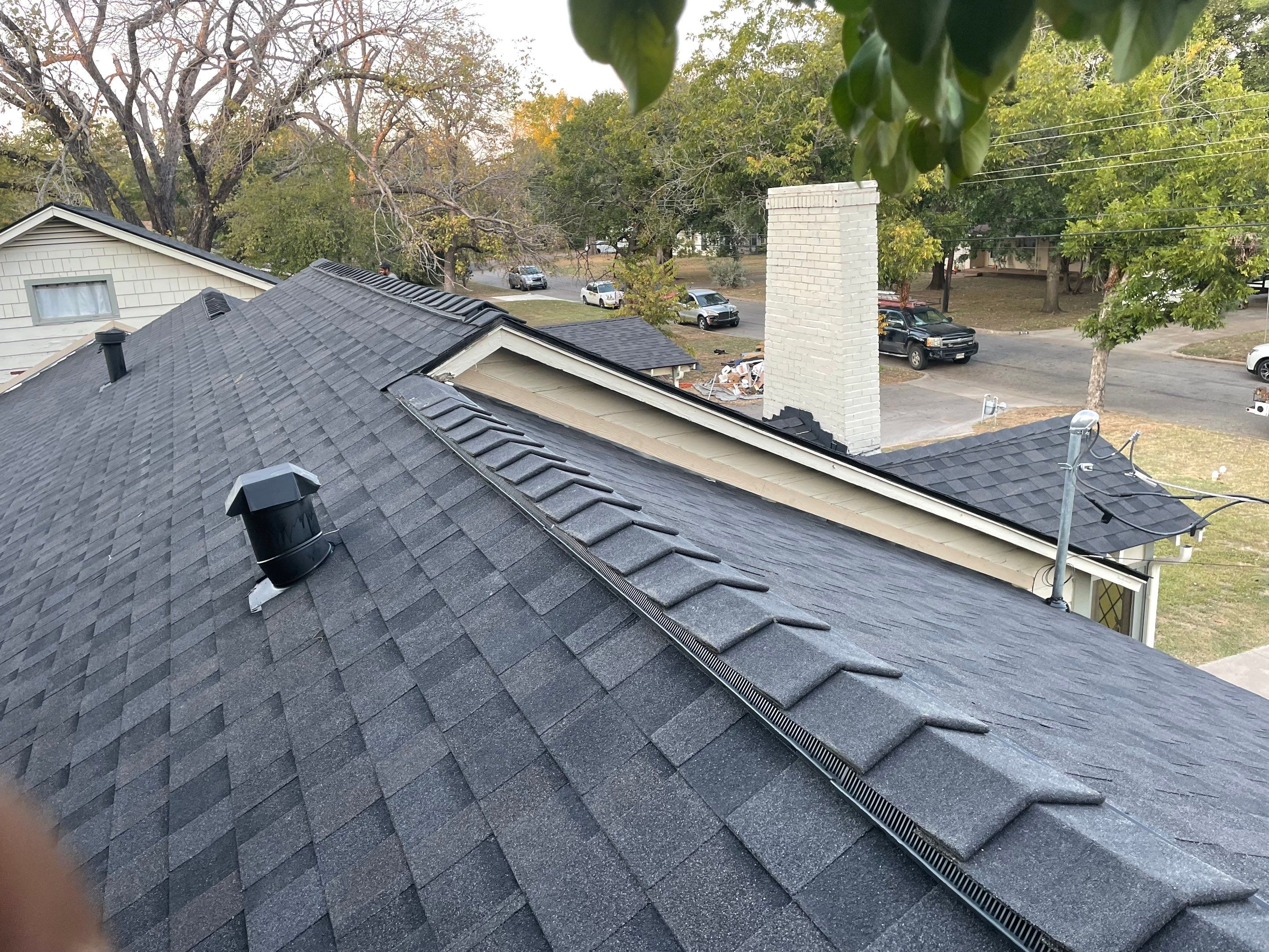 White exterior with IKO Glacier by Tejas Roofworks + Restoration