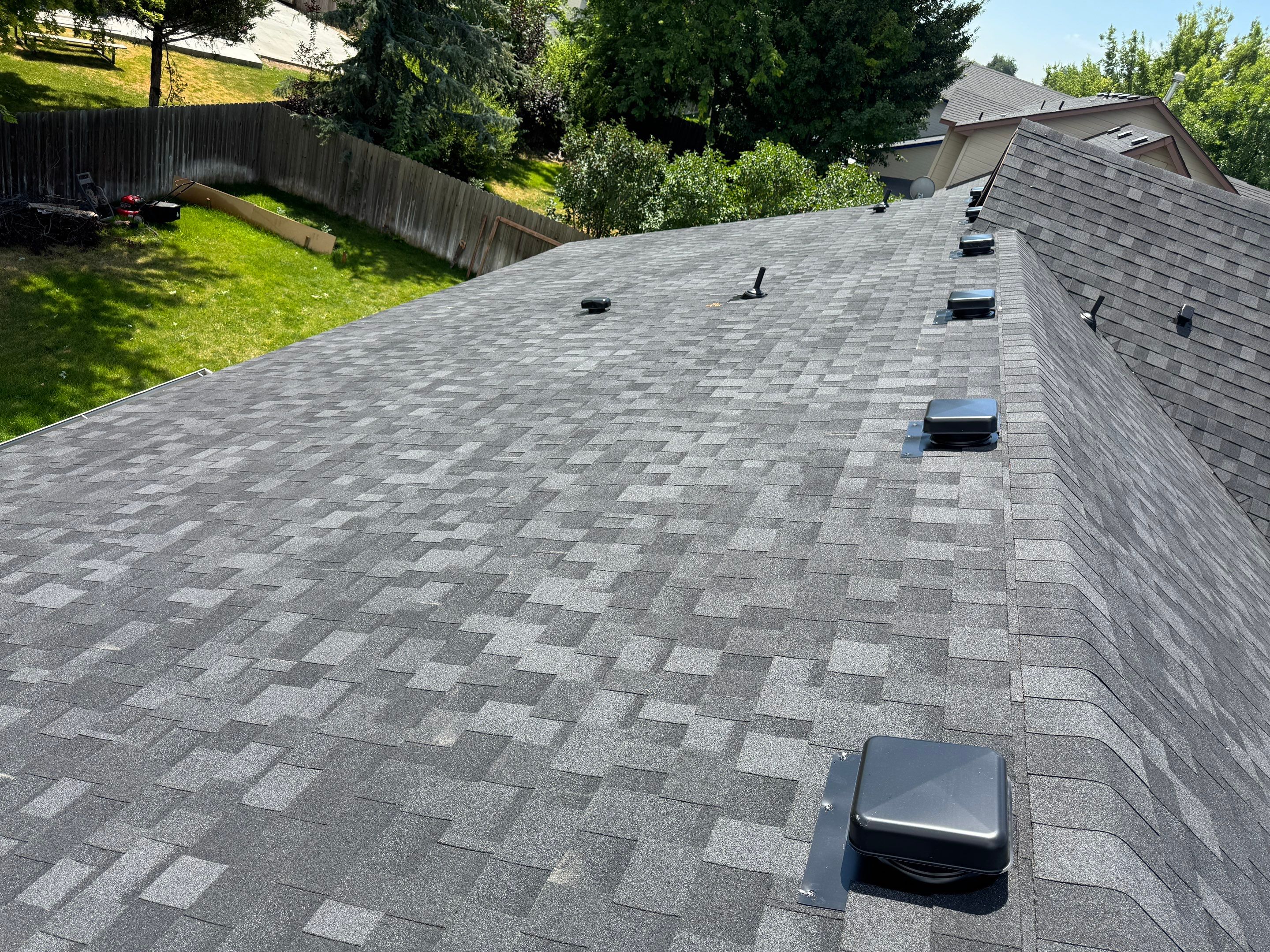Residential Roof Replacement Featuring Charcoal Grey Architectural Shingles by Olive Roofing