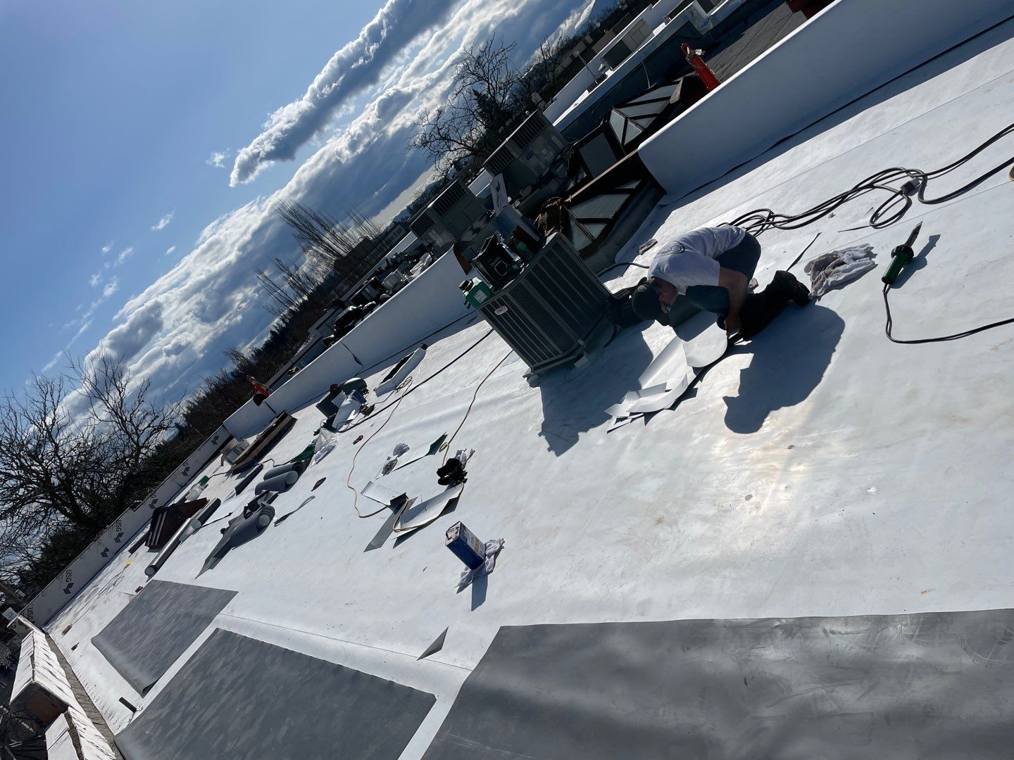 Commercial Flat Roof Installation using GAF 60Mil TPO  by Orezona Building & Roofing Company, Inc.