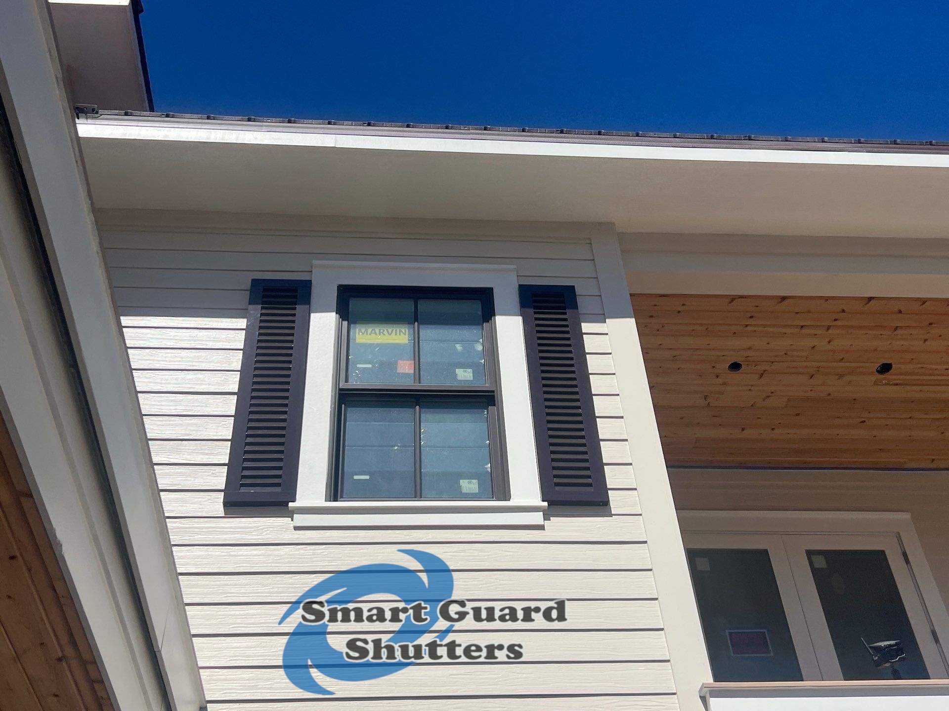 Decorative Colonial Shutters in Grey Brown by Smart Guard Shutters