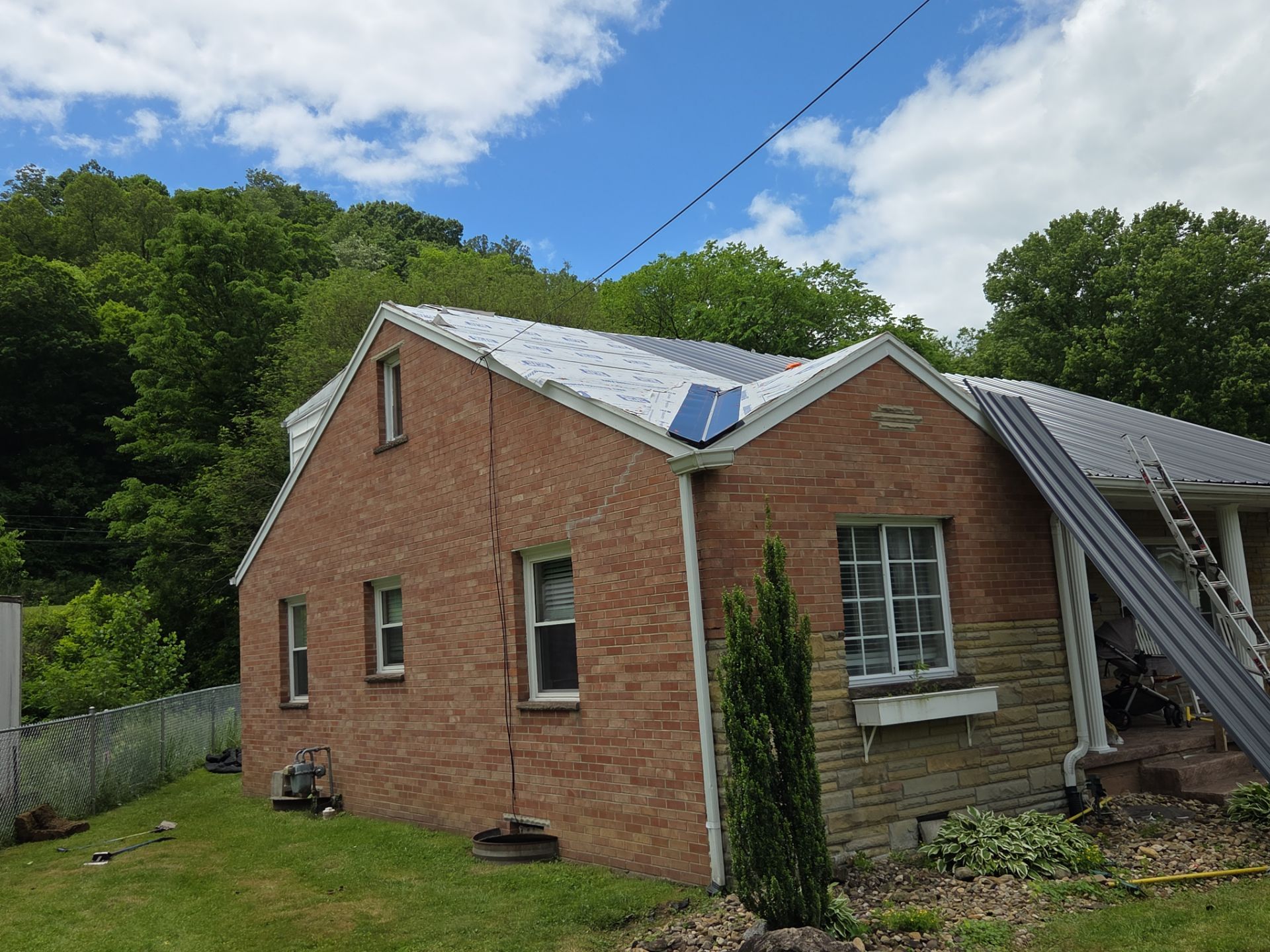 Residential Roofing Installation using Metal by Mr. Roofer