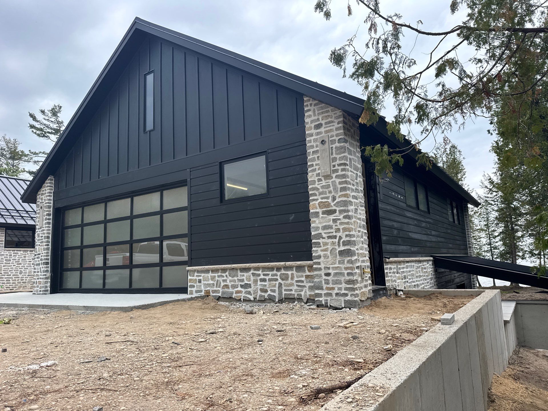 Gutter and Drainage System Installation for Modern Residential Build by Rainbow Seamless Systems