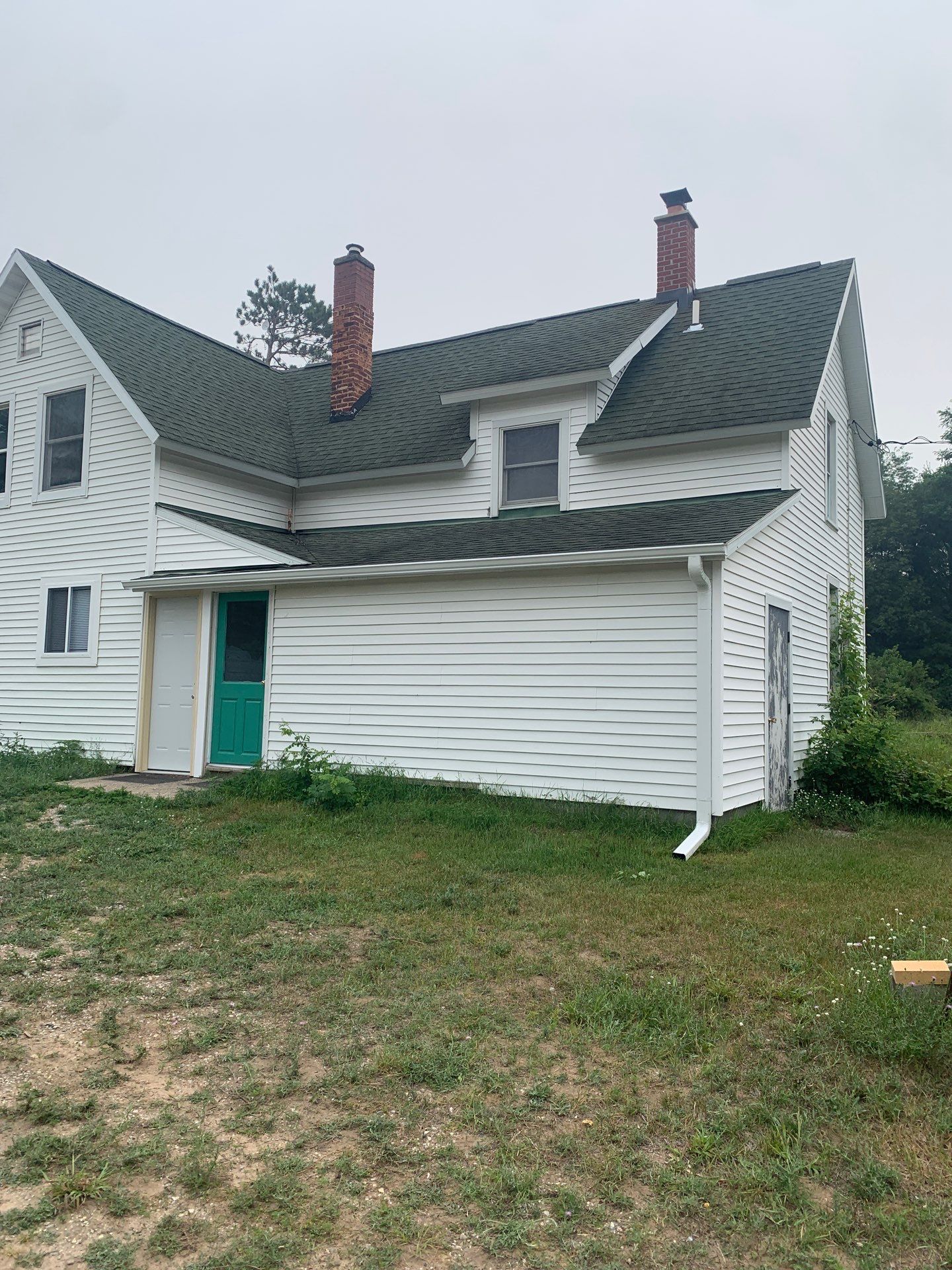 Residential Gutter Installation for House and Outbuilding in Benzonia by Rainbow Seamless Systems