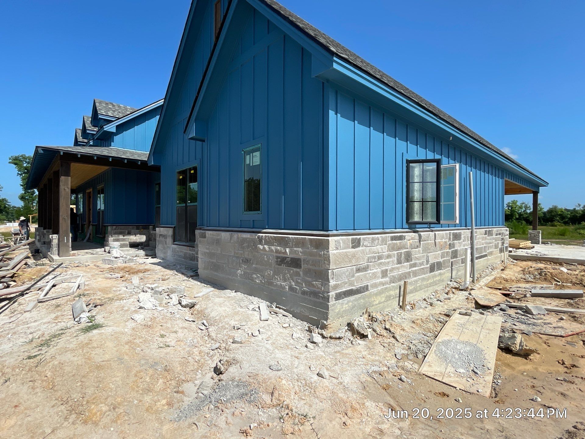 Natural Stone Elegance: Apex Installation Accented by Blue Siding by Apex Conventional Stucco Llc