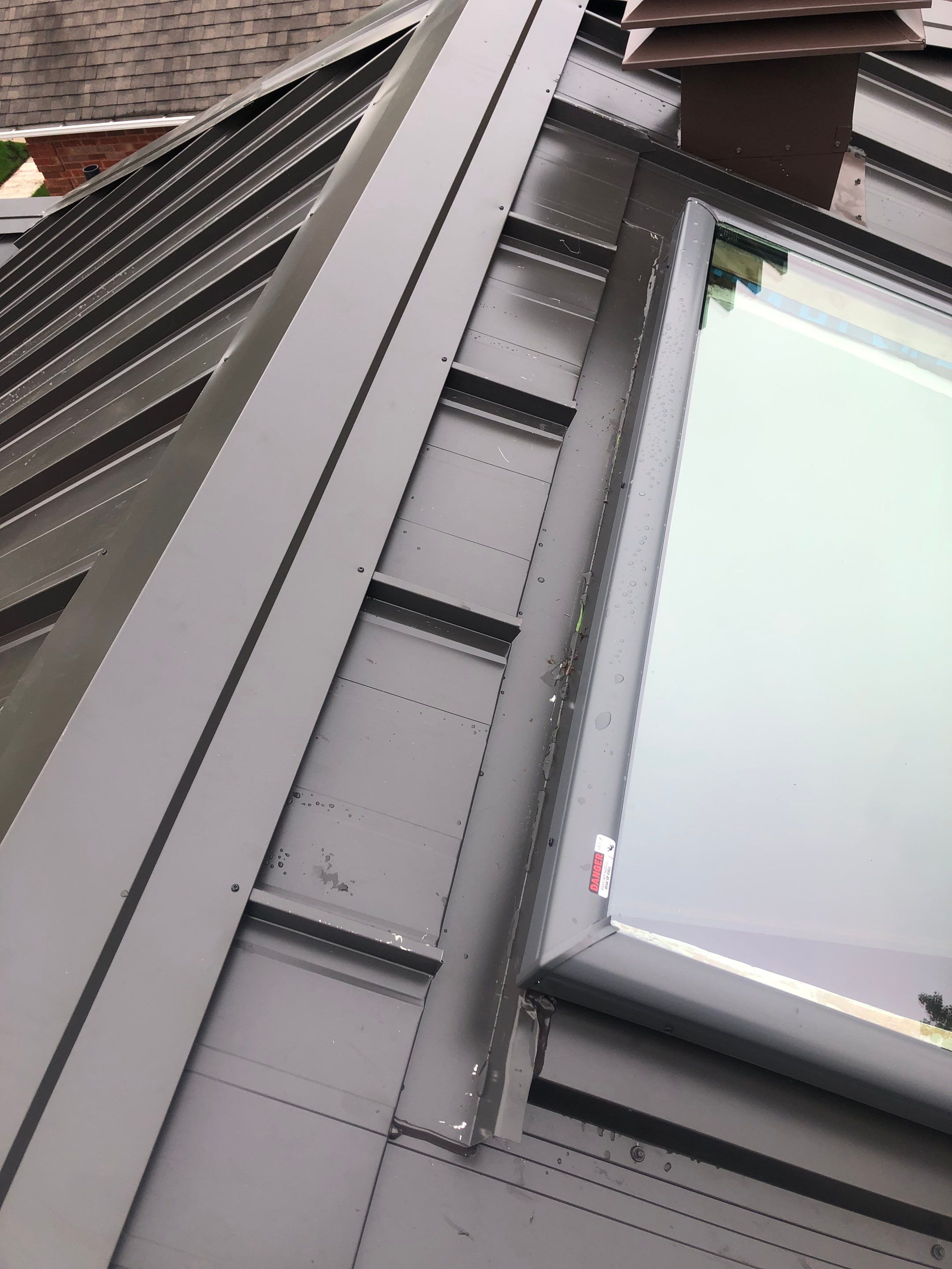 Residential Roofing Installation using 16" Standing Seam Panels by Jay Carter Roofing & Sheet Metal