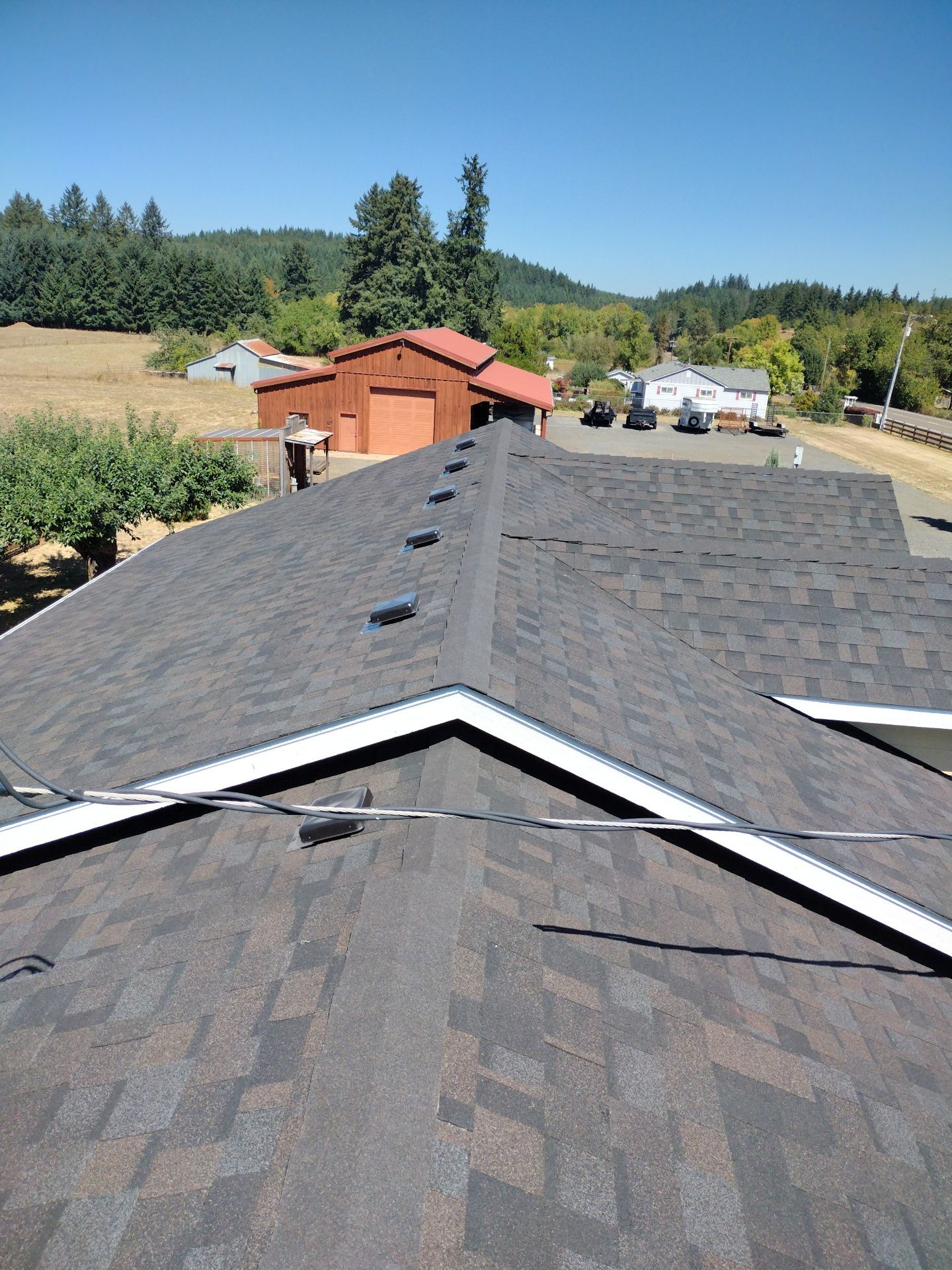 Residential Roof Replacement with Metal Accents by Orezona Building & Roofing Company, Inc.