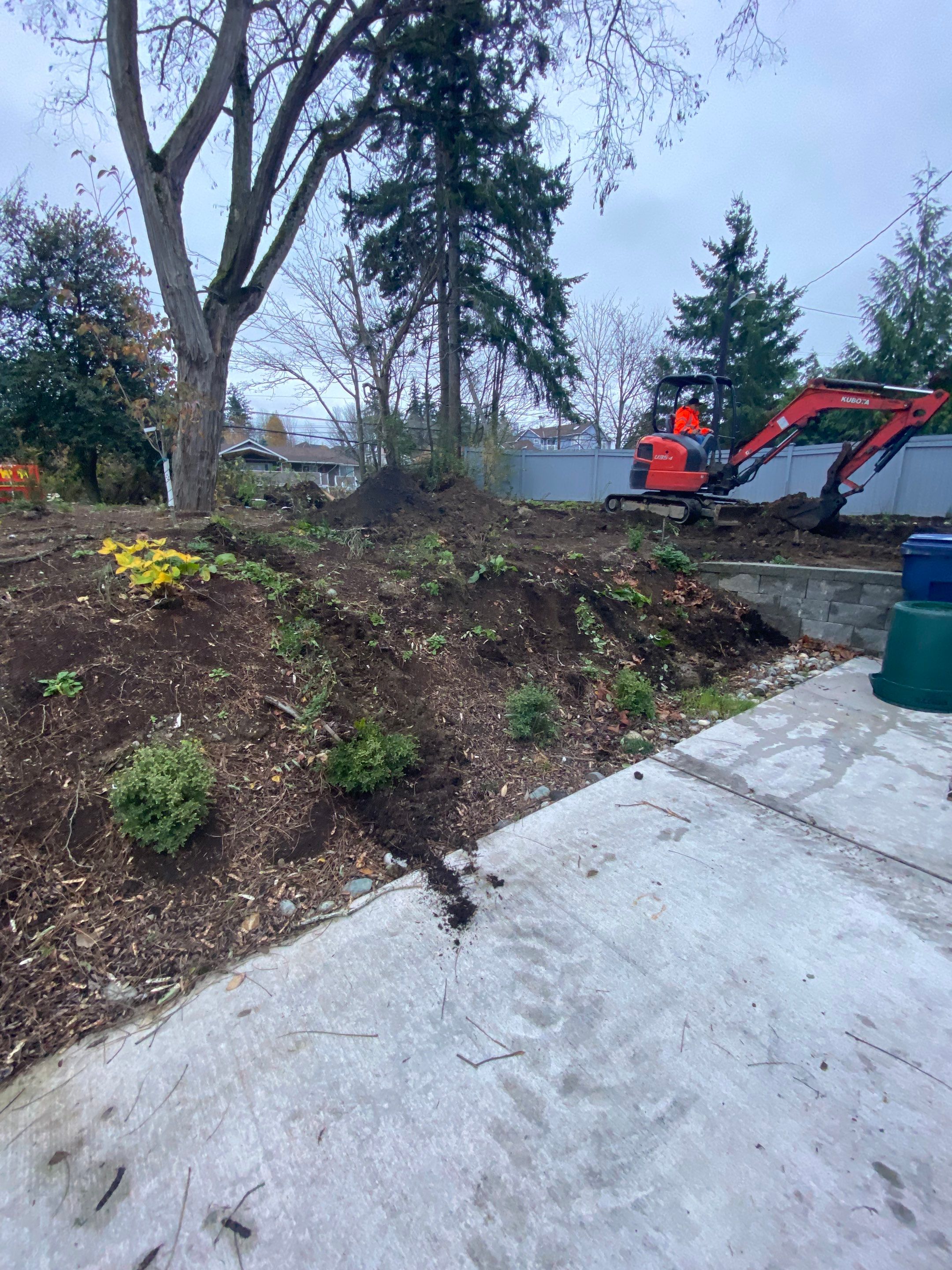 Patio Installation using Concrete, Retaining walls, and Turf install by Jireh Asphalt & Concrete Inc 