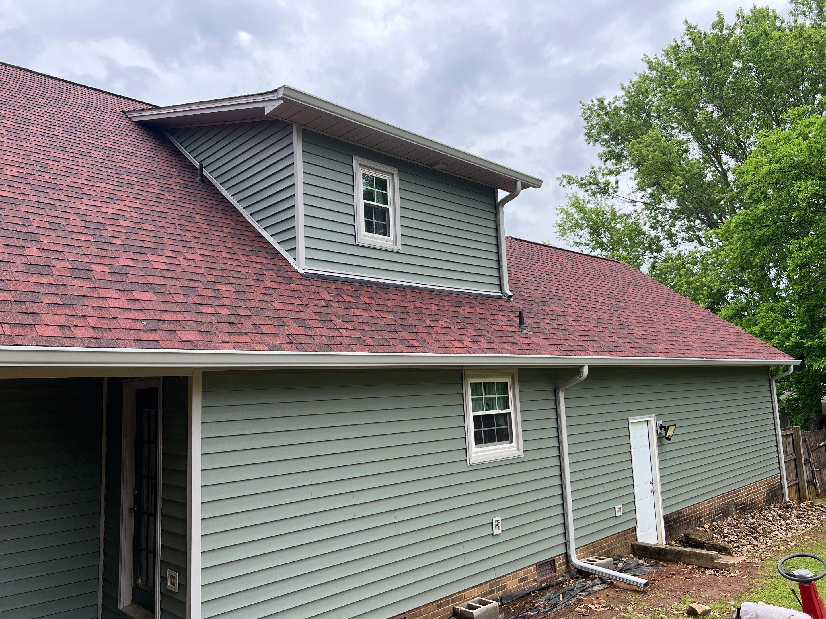 Siding Replacement using Mastic Carvedwood Vinyl Plank by Freedom Exteriors