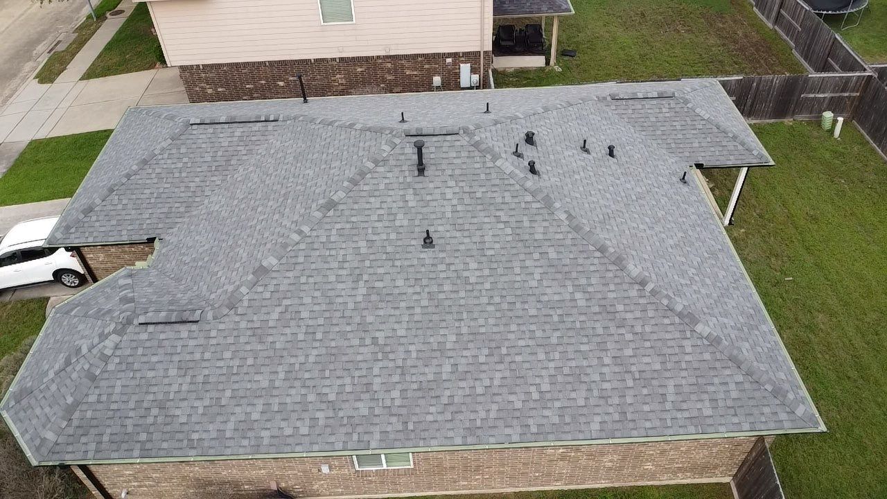 Reroof and Gutter Project in Houston by Roofing Technologies Unlimited