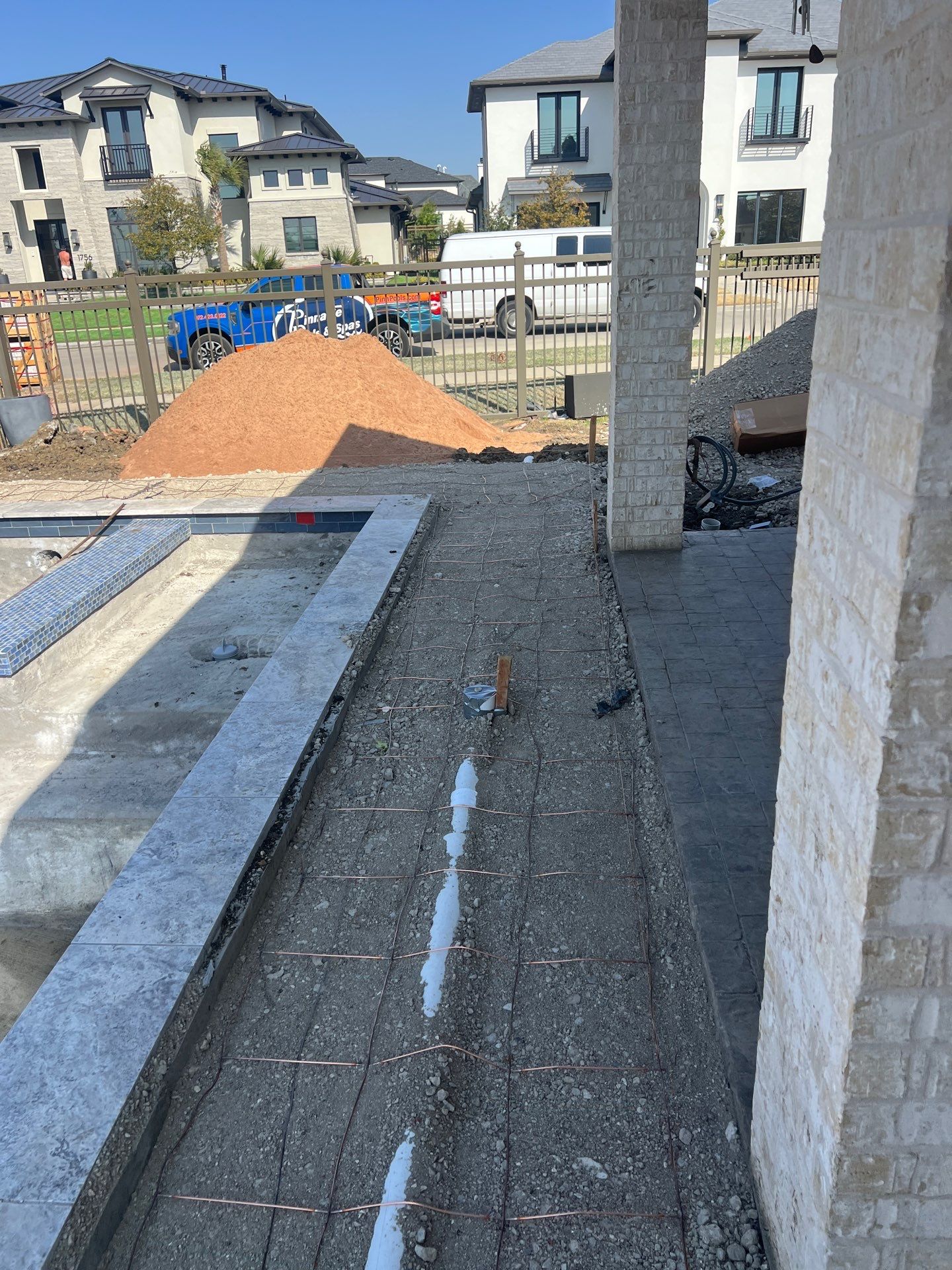 Geometric Pool with Raised Stone Scupper Wall and Outdoor Kitchen by Pinnacle Pools and Spas - DFW