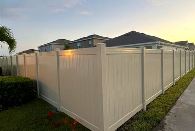 Vinyl Fence Installation using Tan Vinyl Privacy Fence