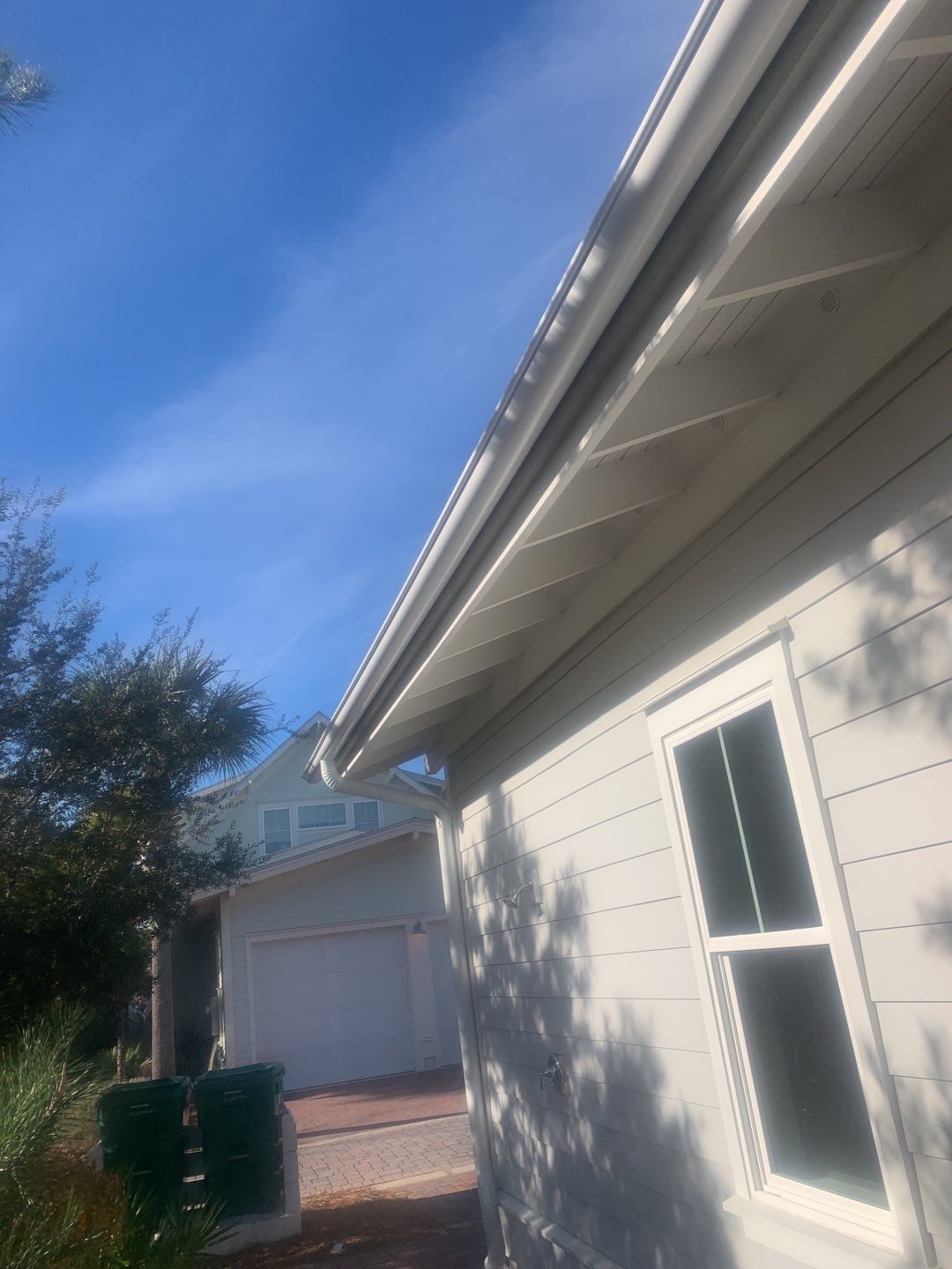 White Half-Round Gutters Installation in Rosemary Beach, FL by Gutter Professors