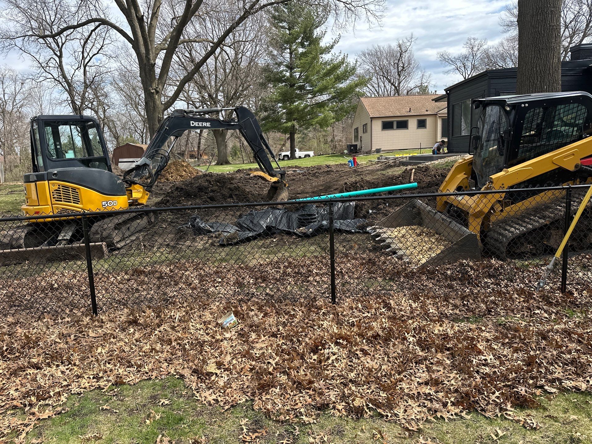 Black Vinyl-Coated Chain Link Fence Installation in Cedar Falls by Perfect Picket Fence and Stain