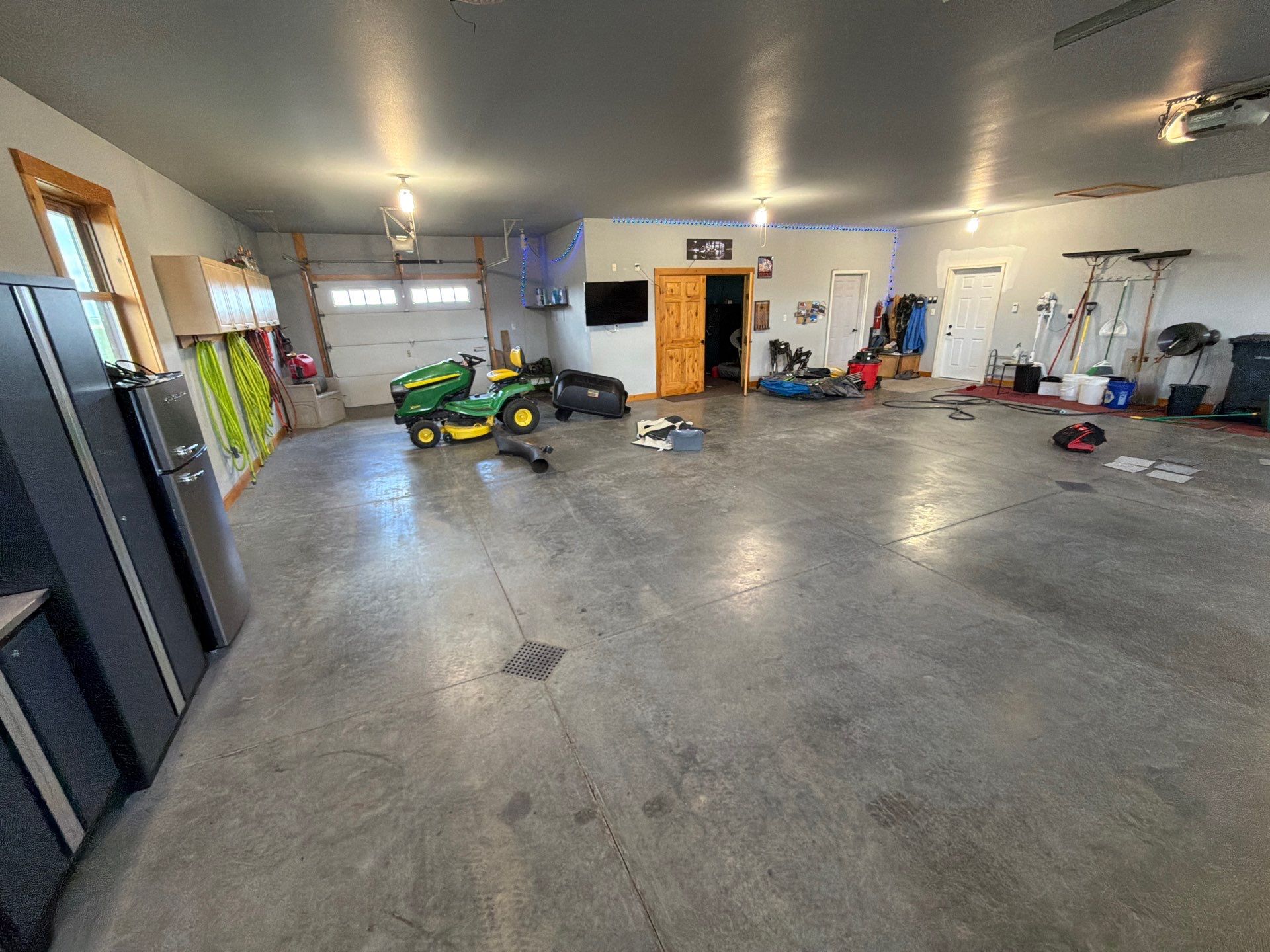 Multi-Car Garage Concrete Coating and Floor Refinishing in Hull by Select Painting, Coatings & Garage Cabinets