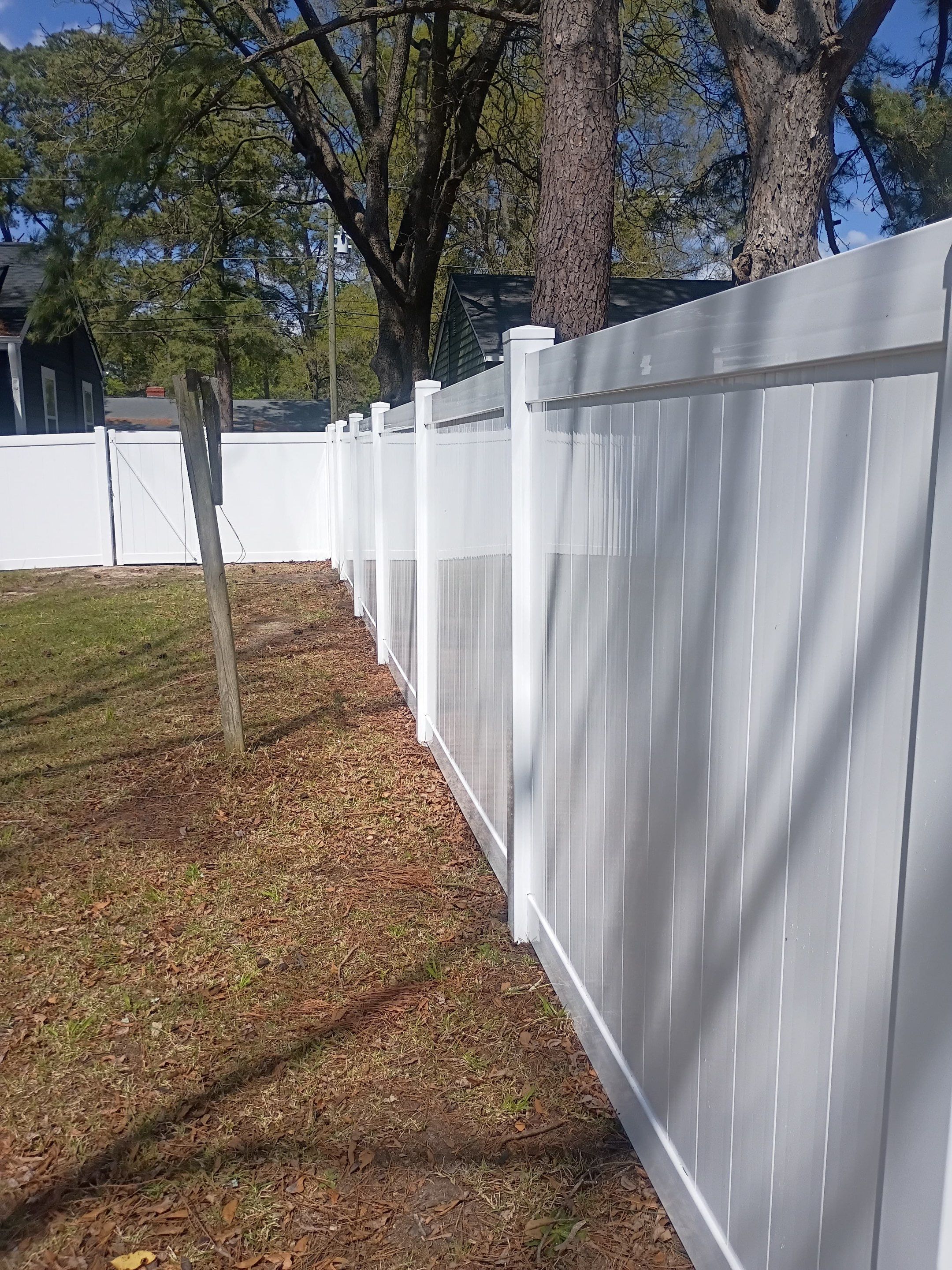 White Vinyl Privacy Fence Installation in Greenville, NC by Superior Fence and Rail