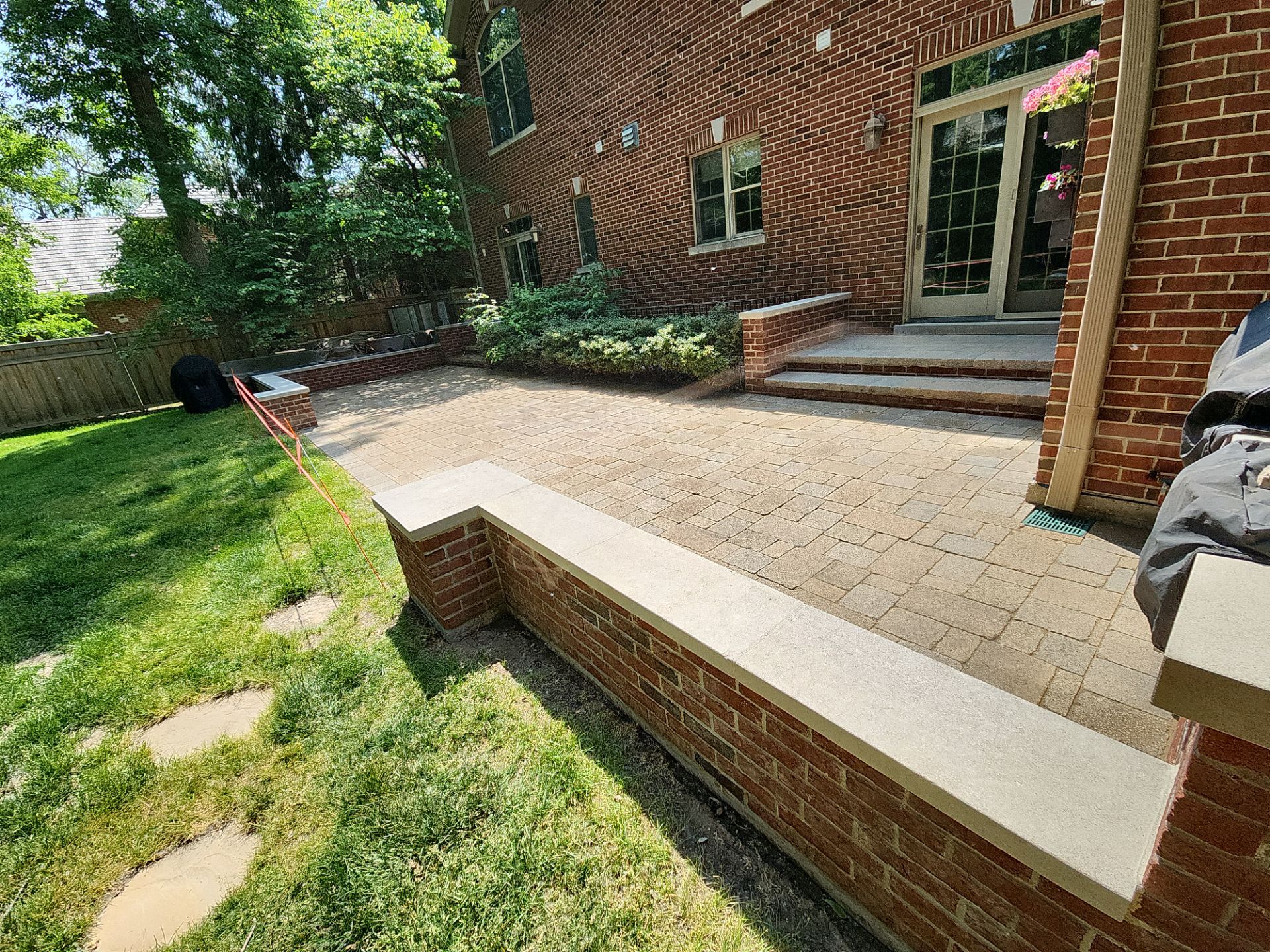 Brick paver repair, clean, seal and poly sanding by Northern Power Washing LLC.