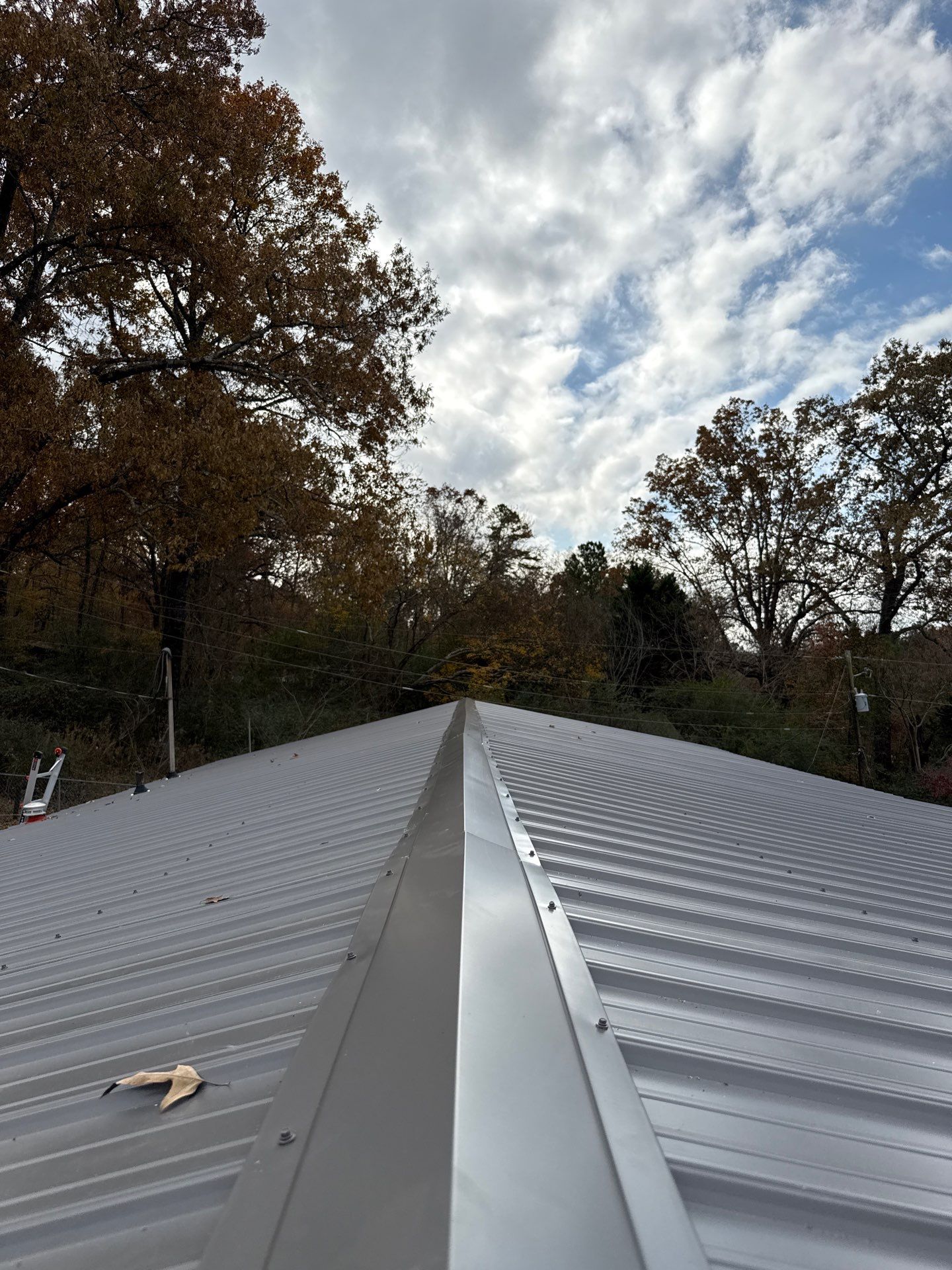 Roof Replacement in Pinson (Metal Roof) by The Roofing Dudes