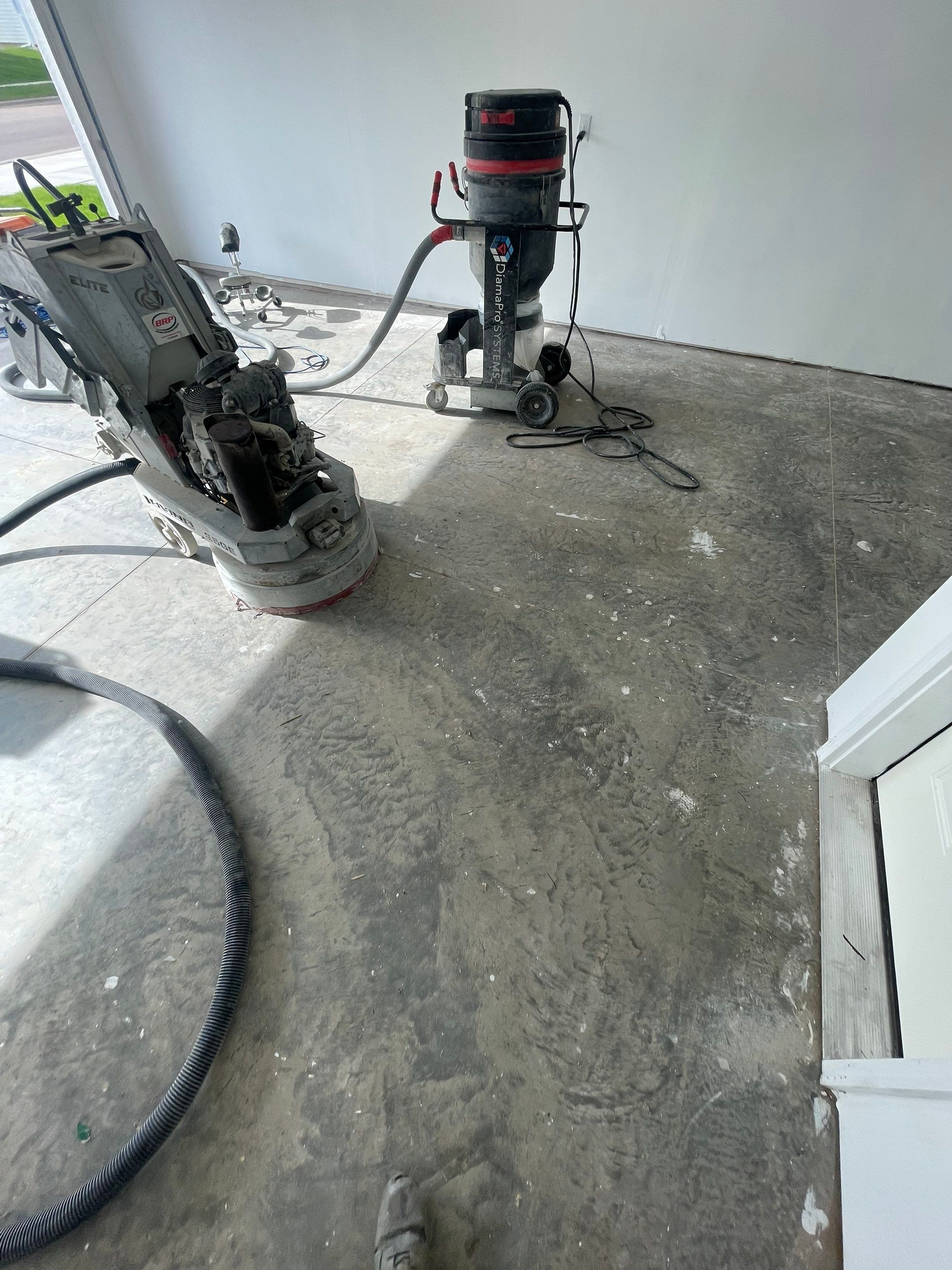 Sioux Falls Garage Floor Transformation with Cabin Fever Decorative Chips by Select Painting, Coatings & Garage Cabinets