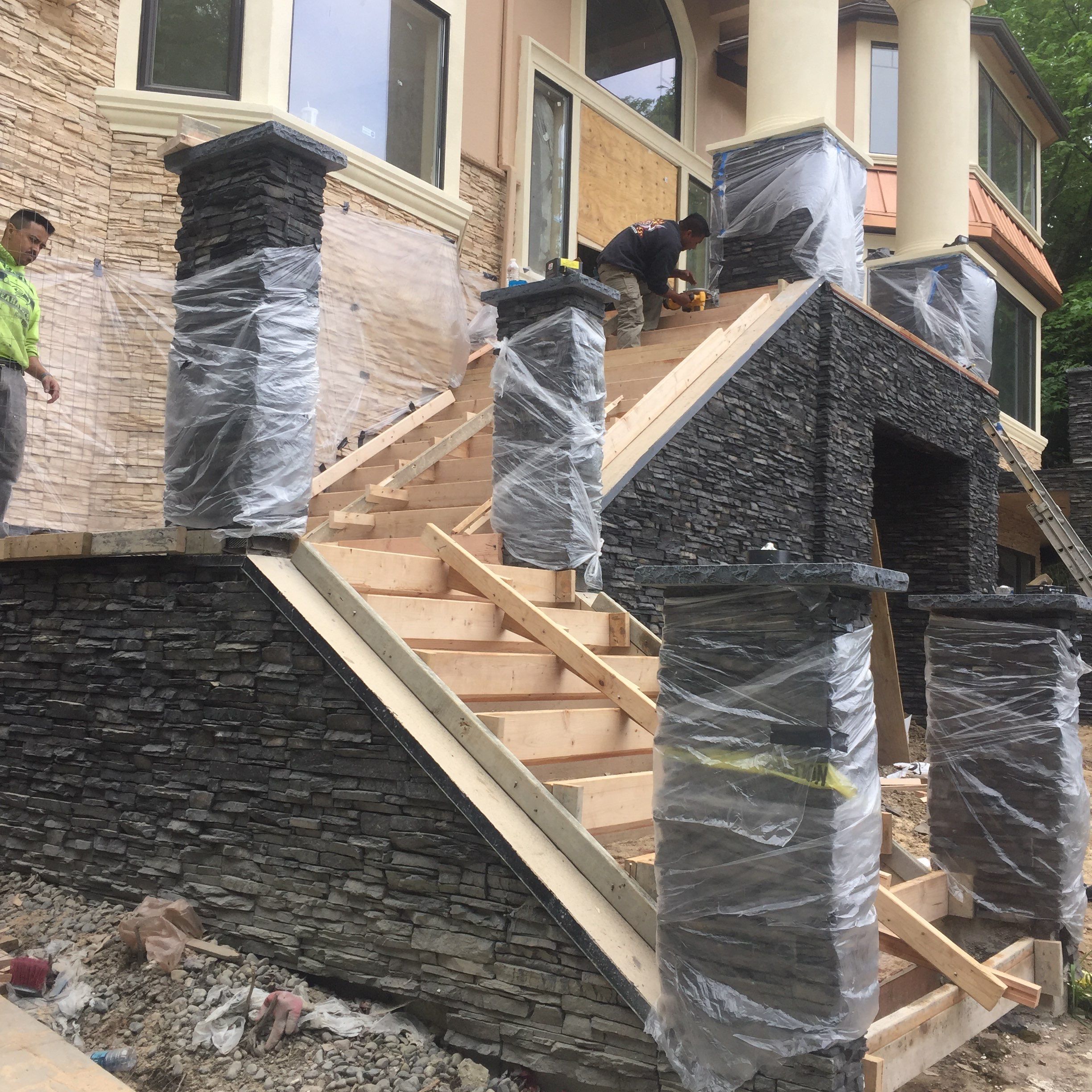 Asphalt Driveway and Stamped Concrete Patio Finish  by Jireh Asphalt & Concrete Inc 