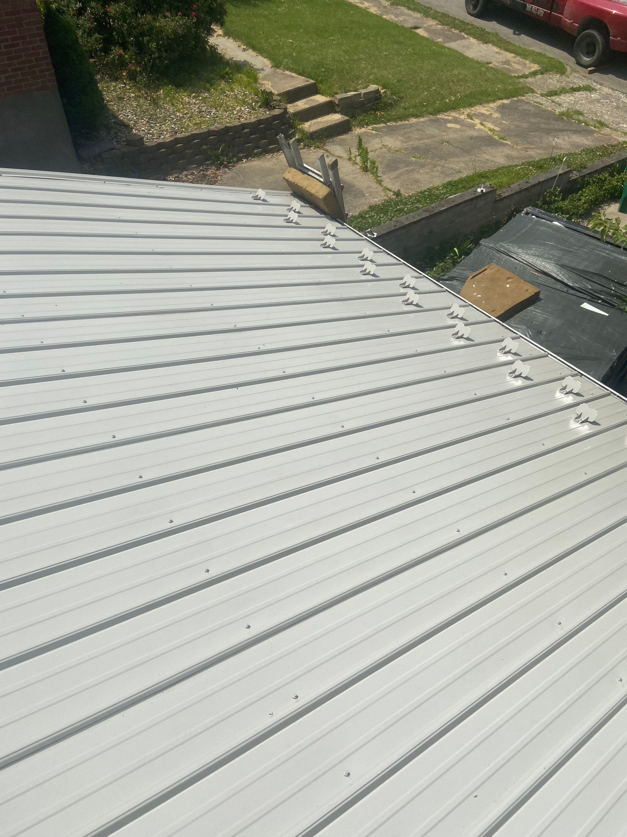 Metal Roofing, Skylights, Porch Build by Secure Construction Company Inc