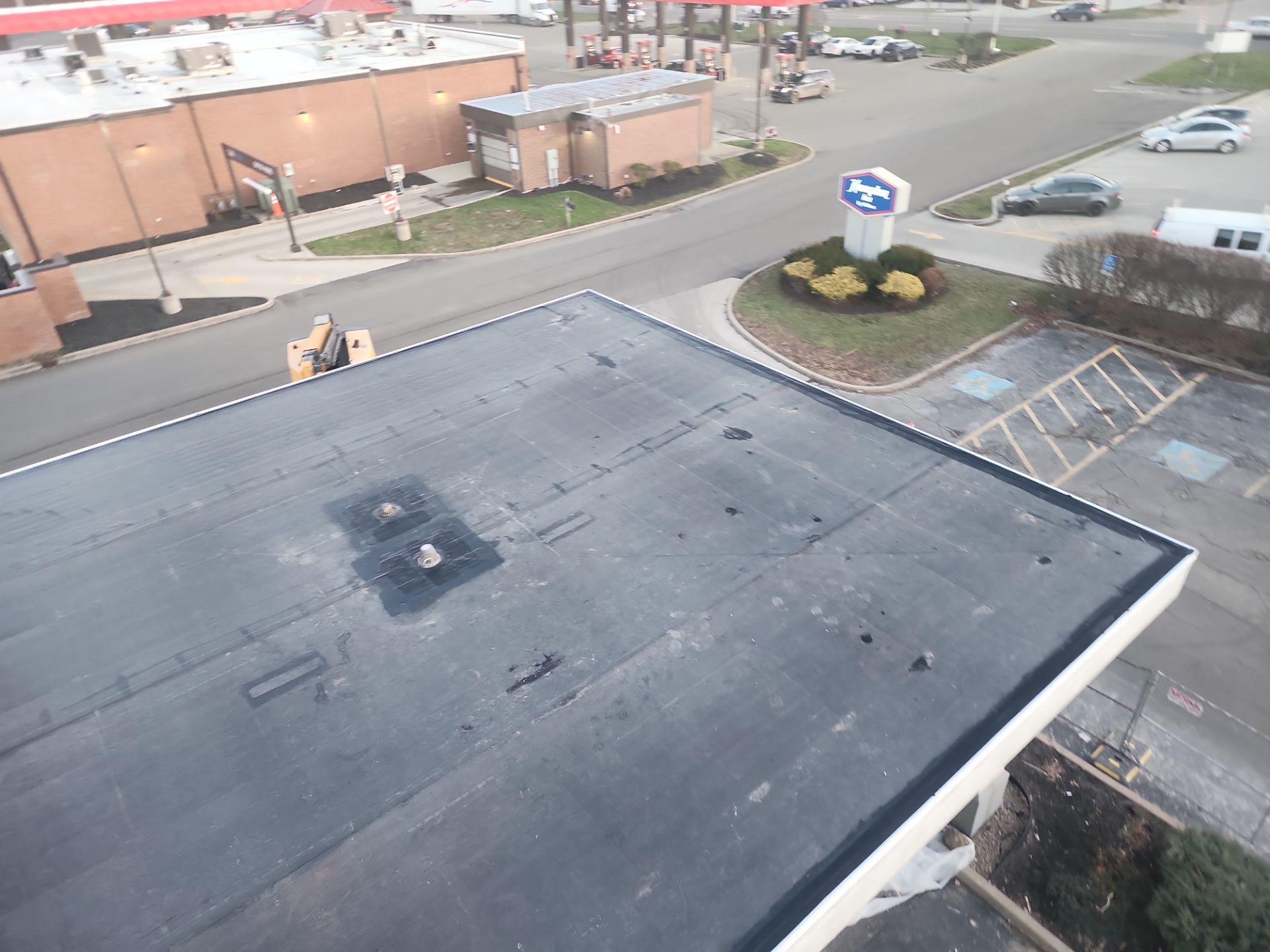 Commercial Roofing Installation using 60 mil rubber roof  by Nitro Roofing and Construction