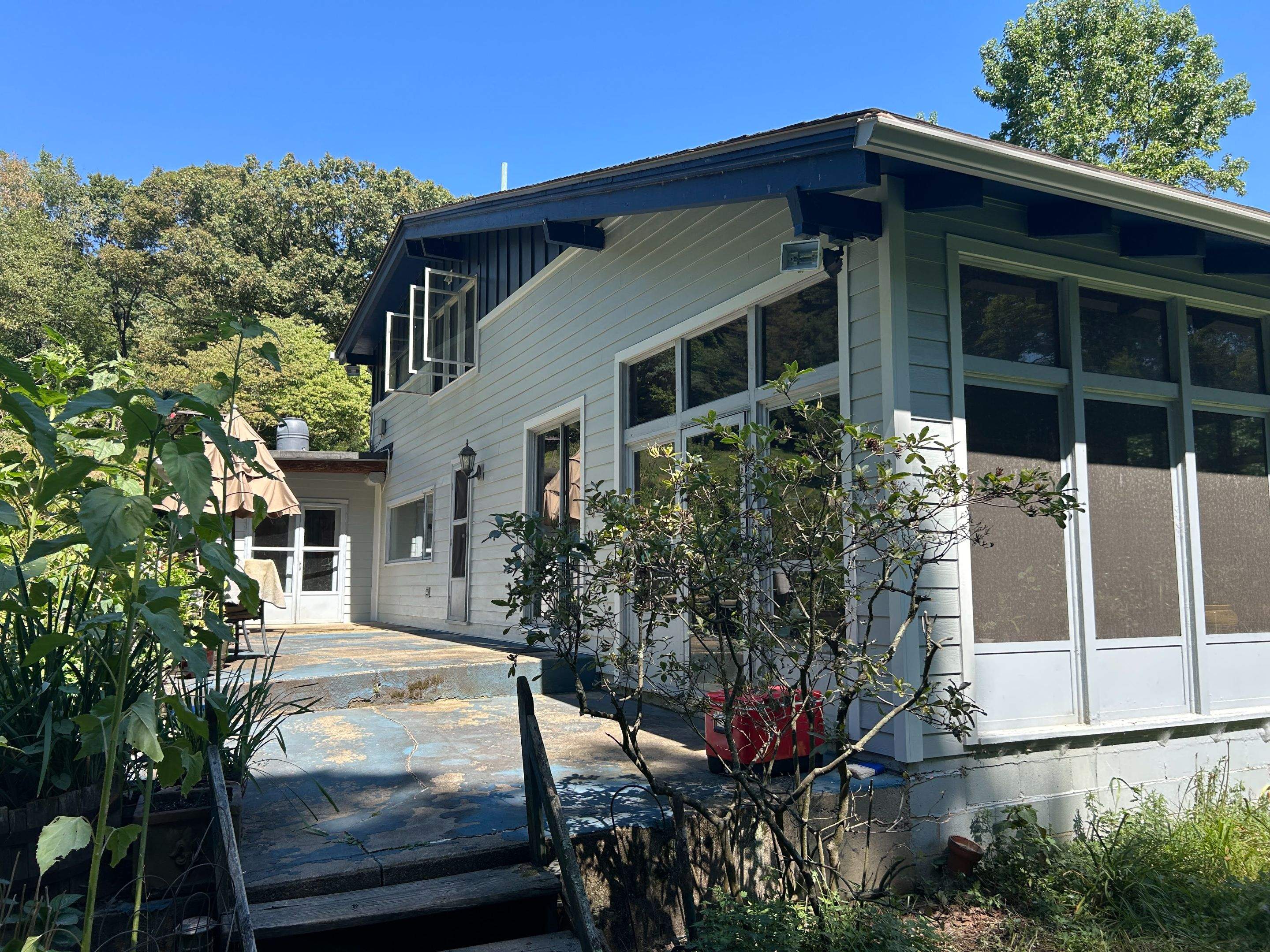 Two-Tone Siding and Sunroom Exterior Remodel in Beaver Falls by Ideal Siding Pittsburgh