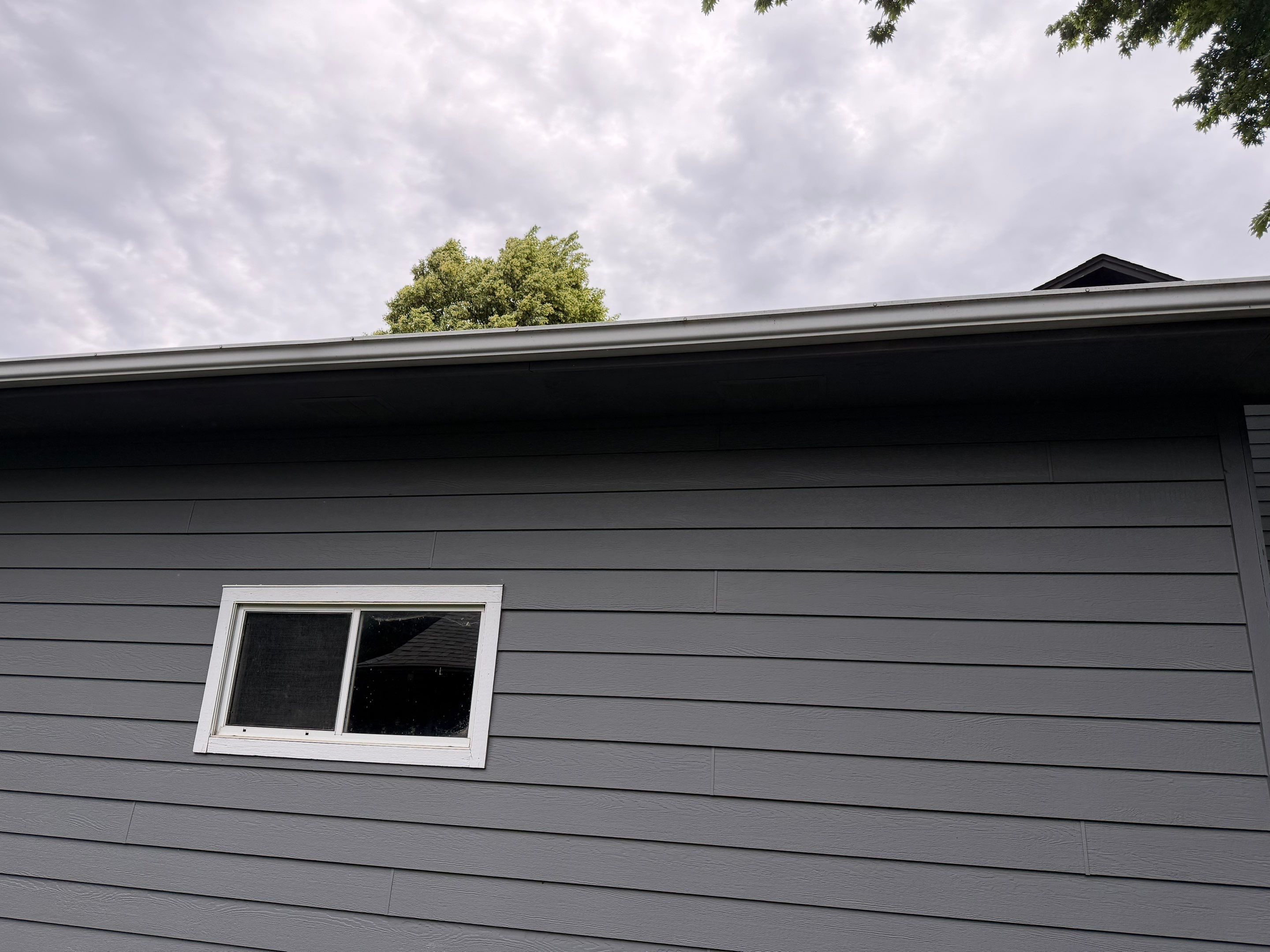 Full Exterior Painting for Gray Siding and Trim in Sioux Falls by Select Painting, Coatings & Garage Cabinets