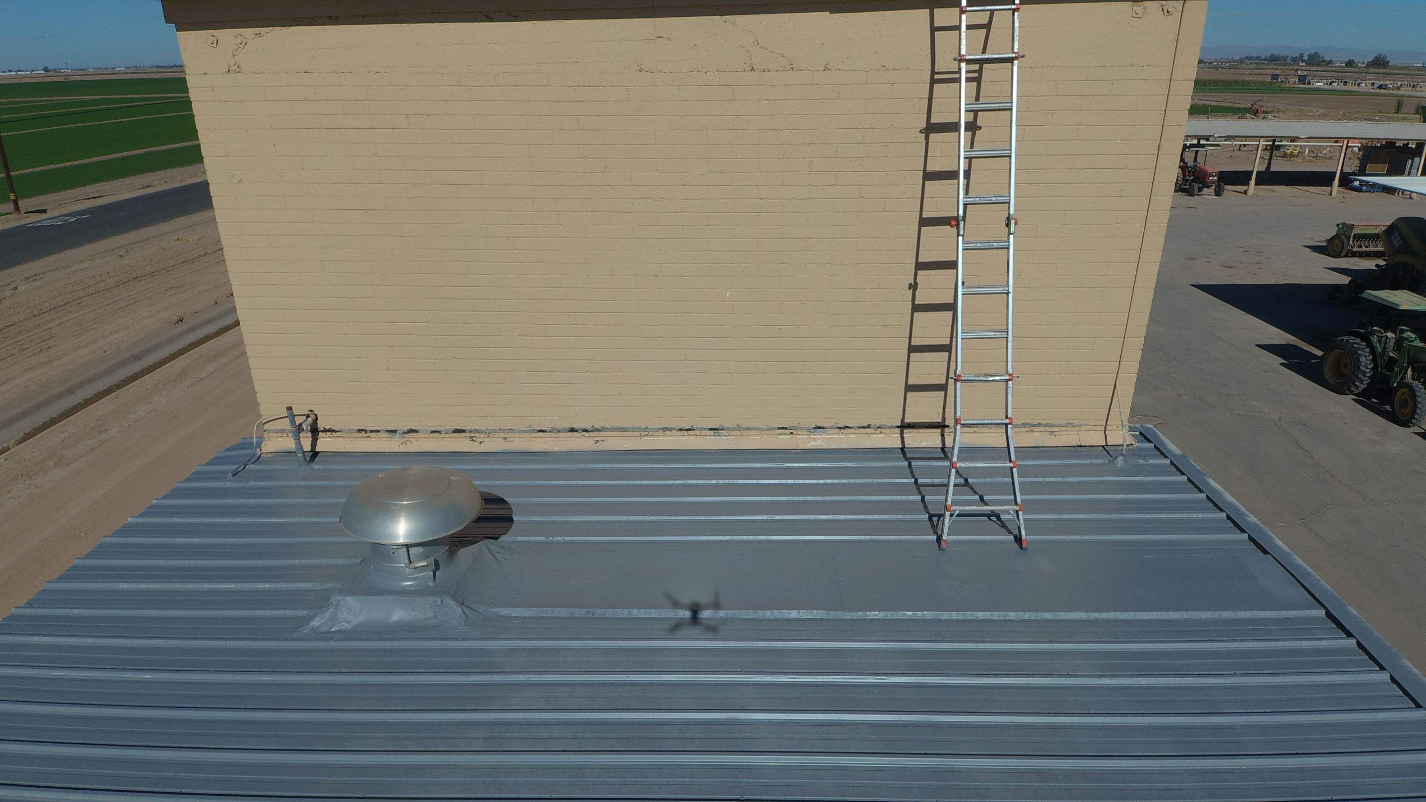 Metal roof restoration on commercial roof using Conklin Benchmark/PUMA XL fabric and coating by Straight Edge Roofing Inc