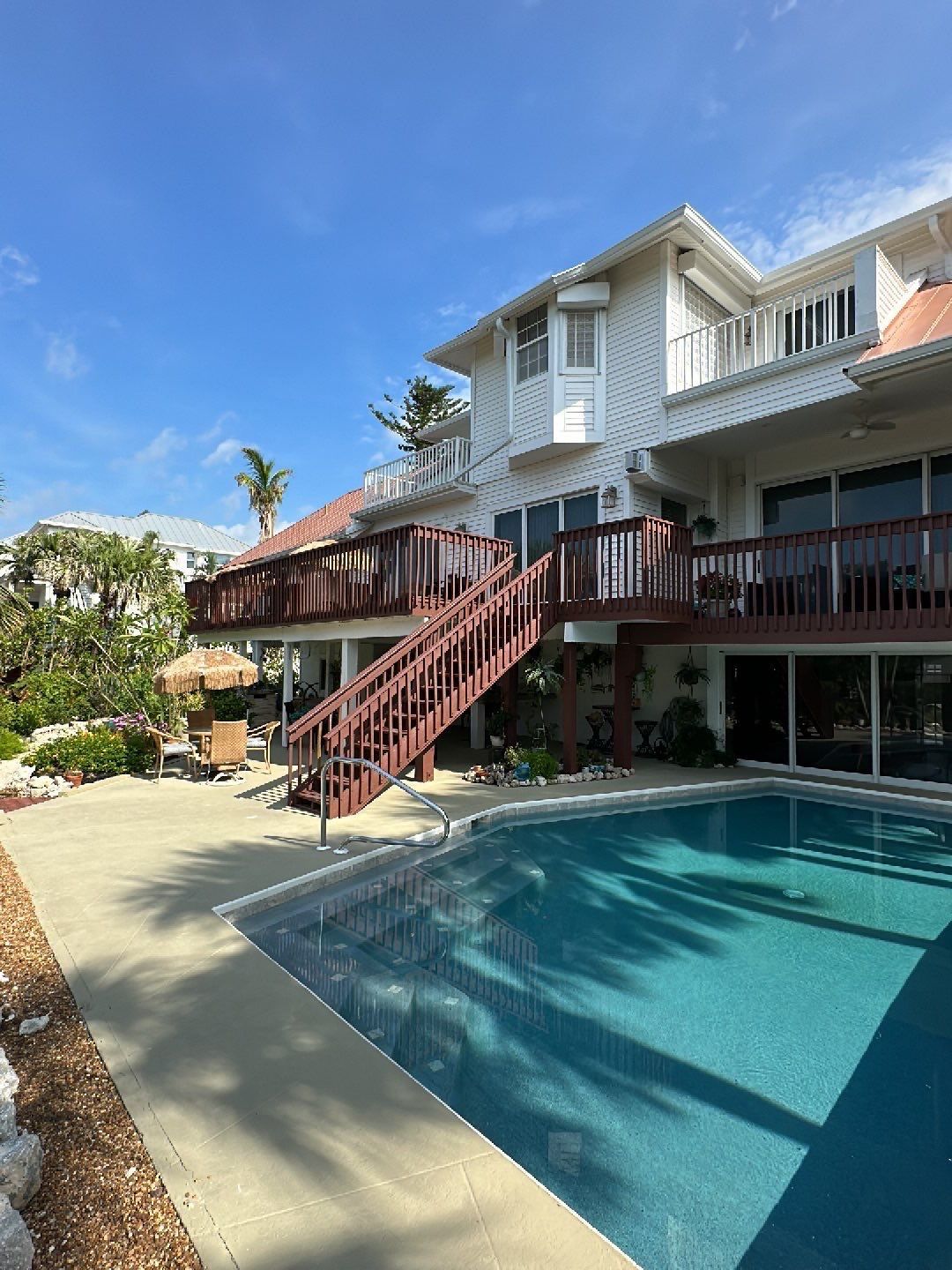 White K-Style Gutters Installed with White Downspouts in Sanibel FL by Gutter Professors