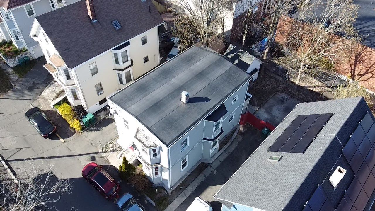 Residential Rubber Roofing -2 Story Home  by Delarosa Construction & Design