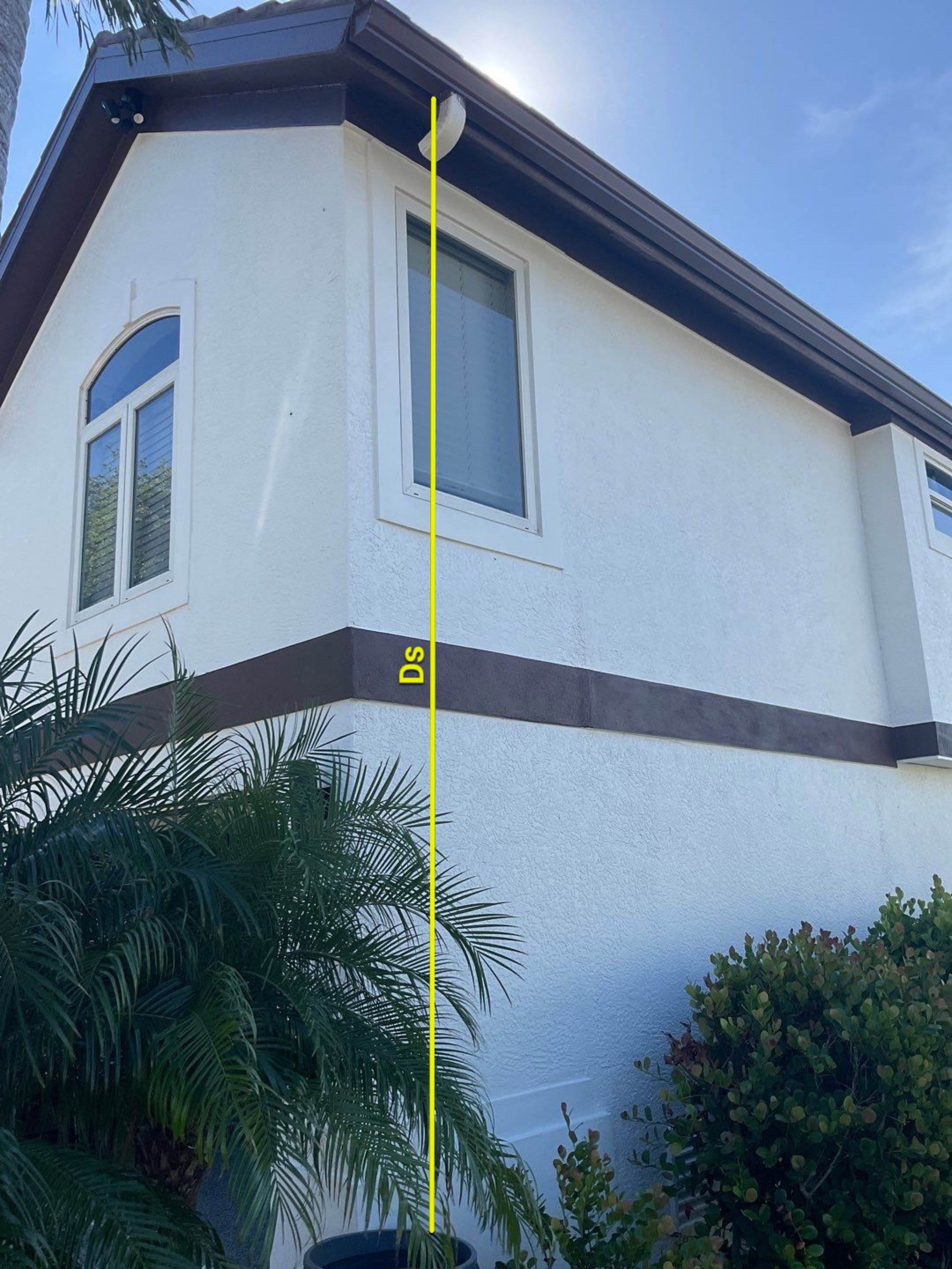 Musket Brown 7-Inch Gutters and White Down Spouts in Sanibel FL by Gutter Professors