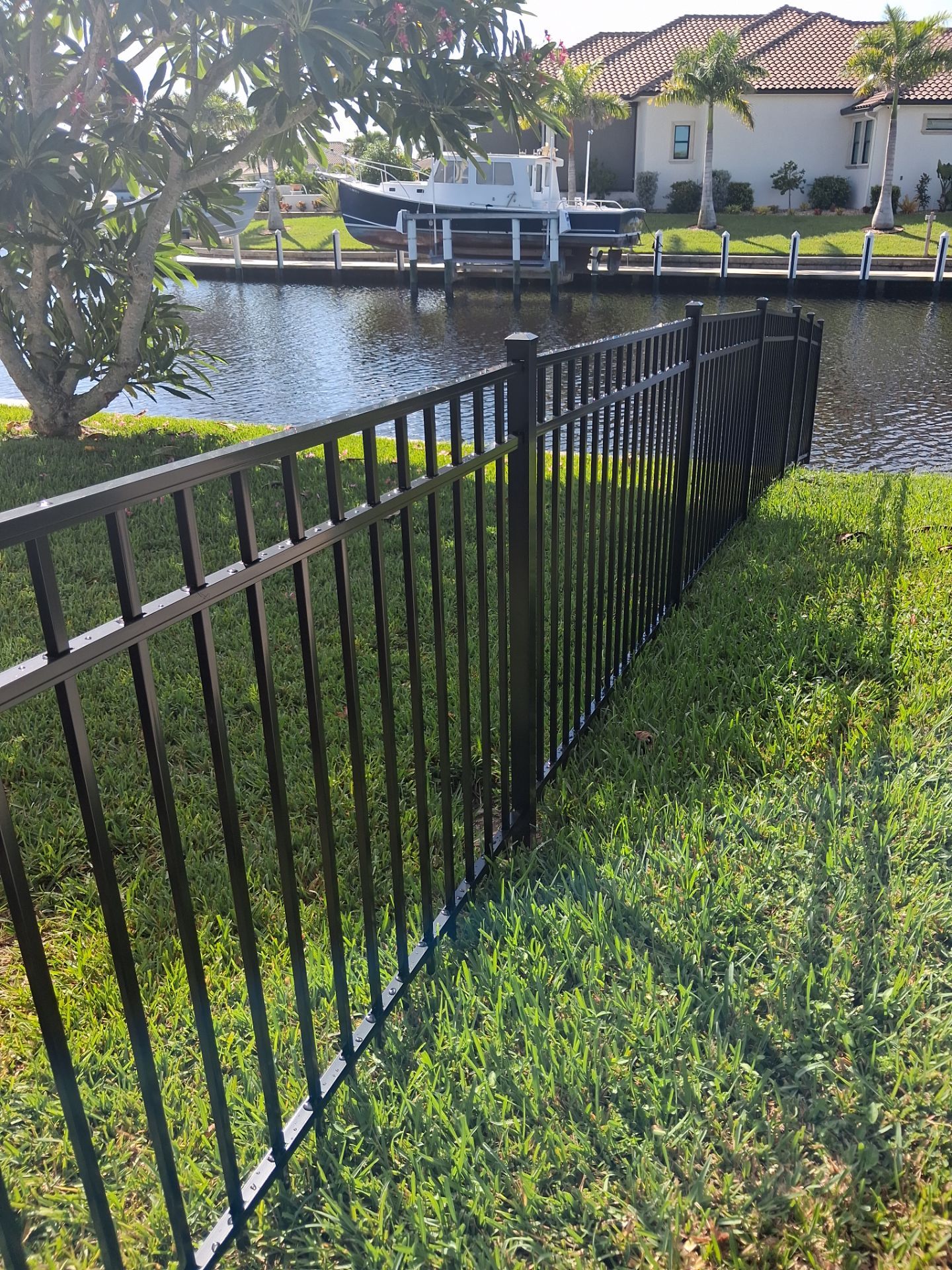 Custom Black Aluminum Fence Enclosure for Punta Gorda Waterfront Property by True Fence LLC