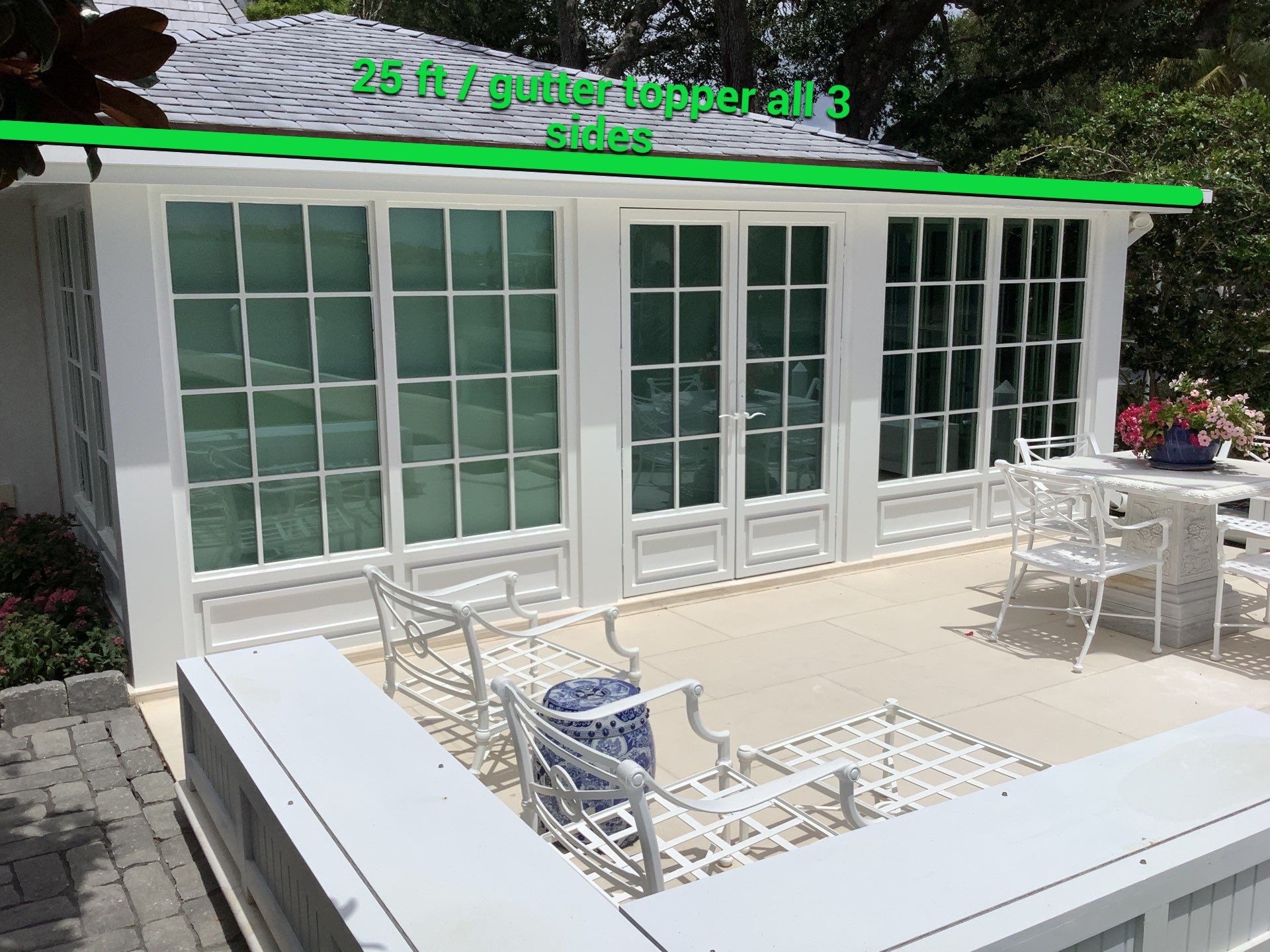 Seamless aluminum gutter installation in Sarasota, FL using 3x4 elbow downspouts combined with round downspouts by Gutter Professors