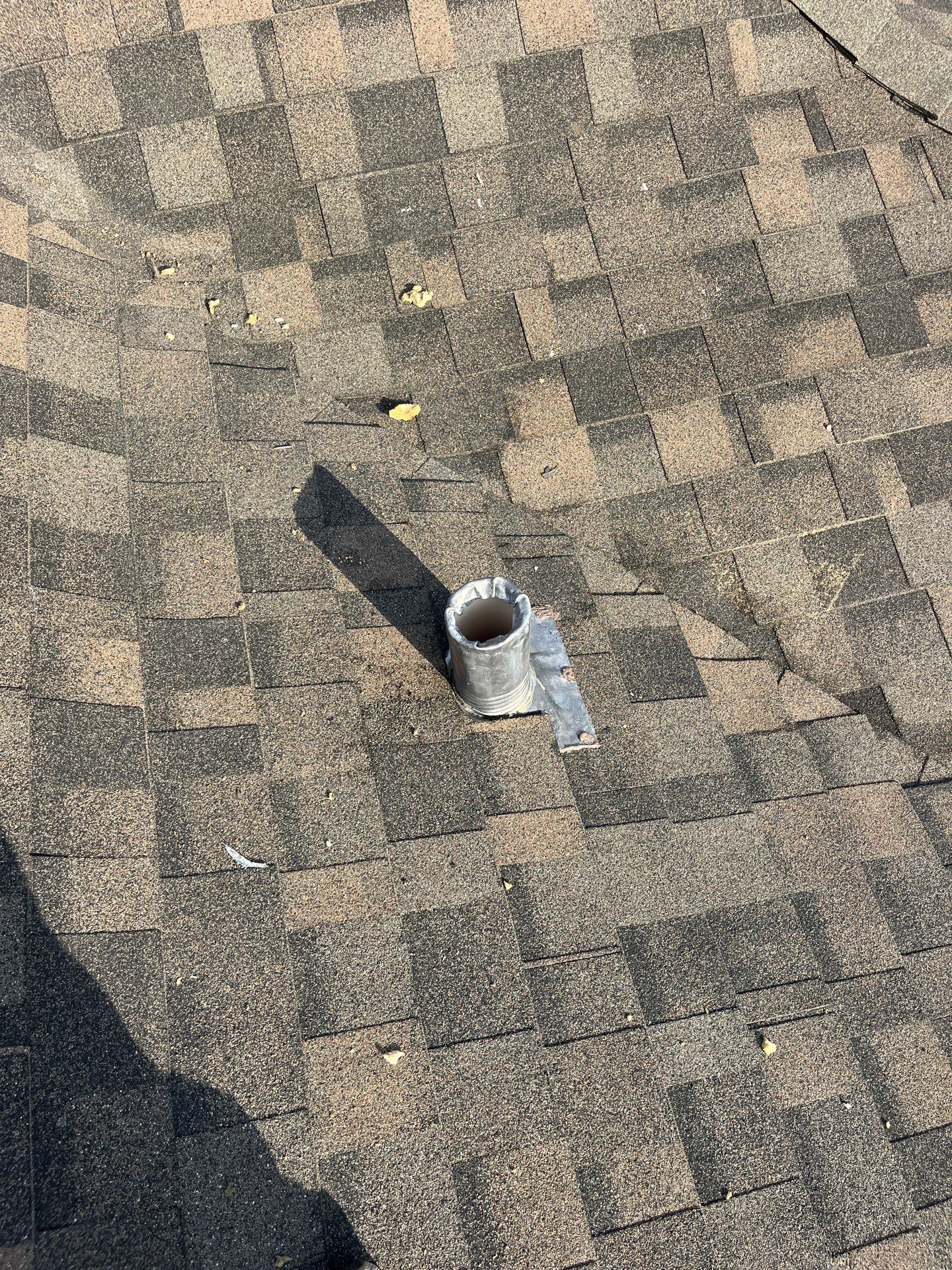 Tan exterior with IKO Driftshake by Tejas Roofworks + Restoration